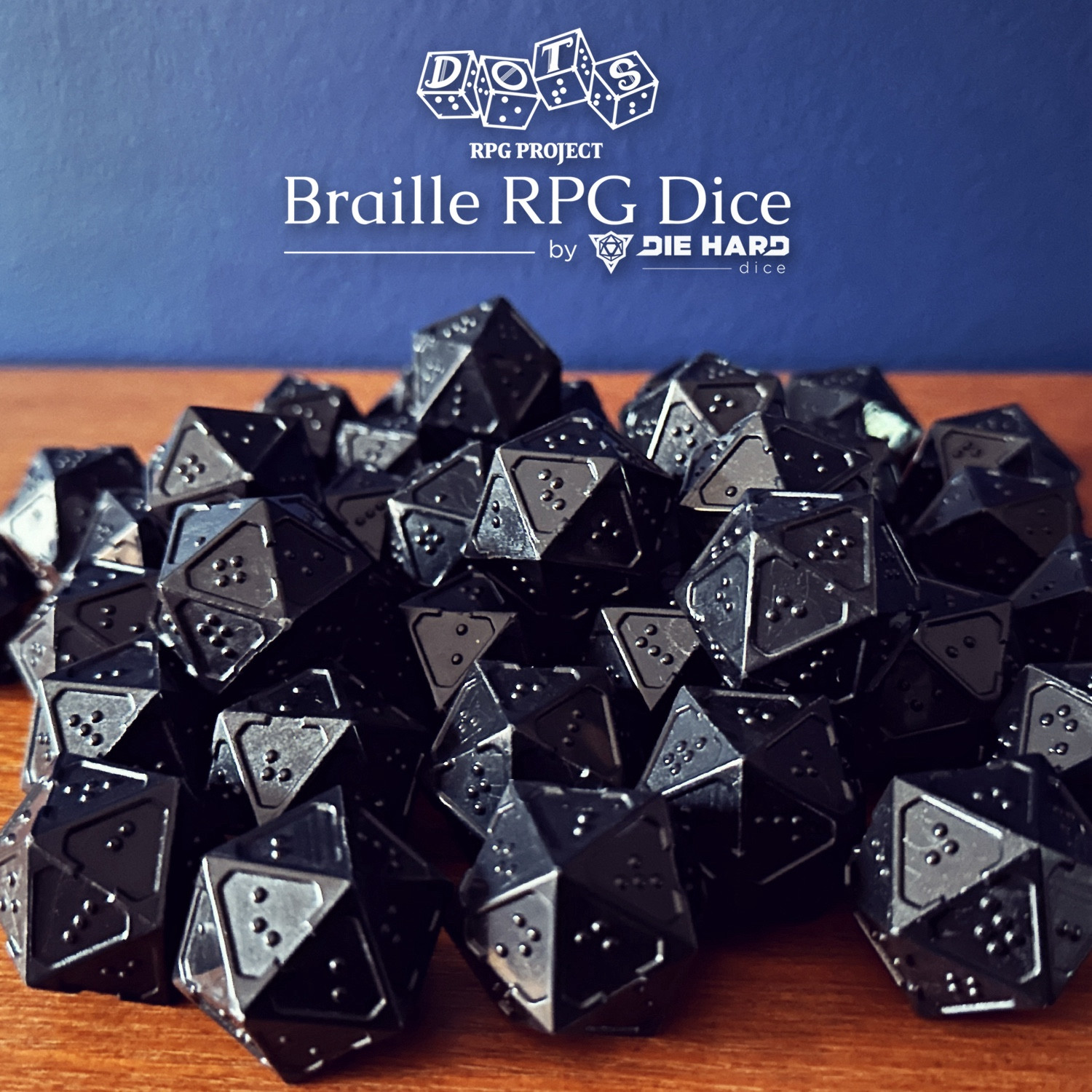 Photograph - pile of many black braille d20s. The dice use a single character of letters A-T per face on all dice for numbers 1-20. The edges around all dice faces are raised with one border having a small divot in the center to act as an orientation marker, signifying the bottom of a braille cell. The other edges around the face are flatter and thicker to provide increased stability when reading. Logo reads DOTS RPG Project Braille RPG Dice by Die Hard Dice.