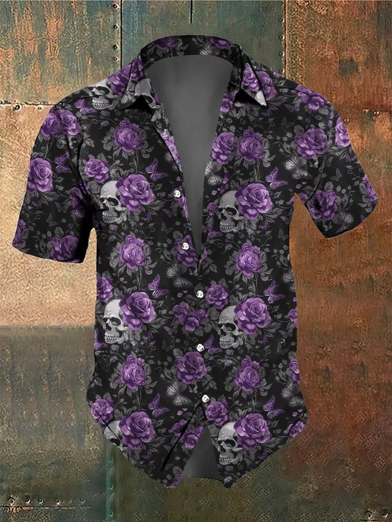 Men's short sleeve button up shirt with a print of skulls and purple roses on black.