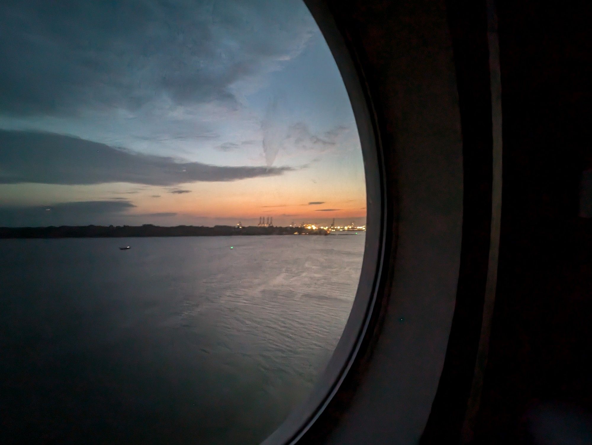 Dusk outside the round window.