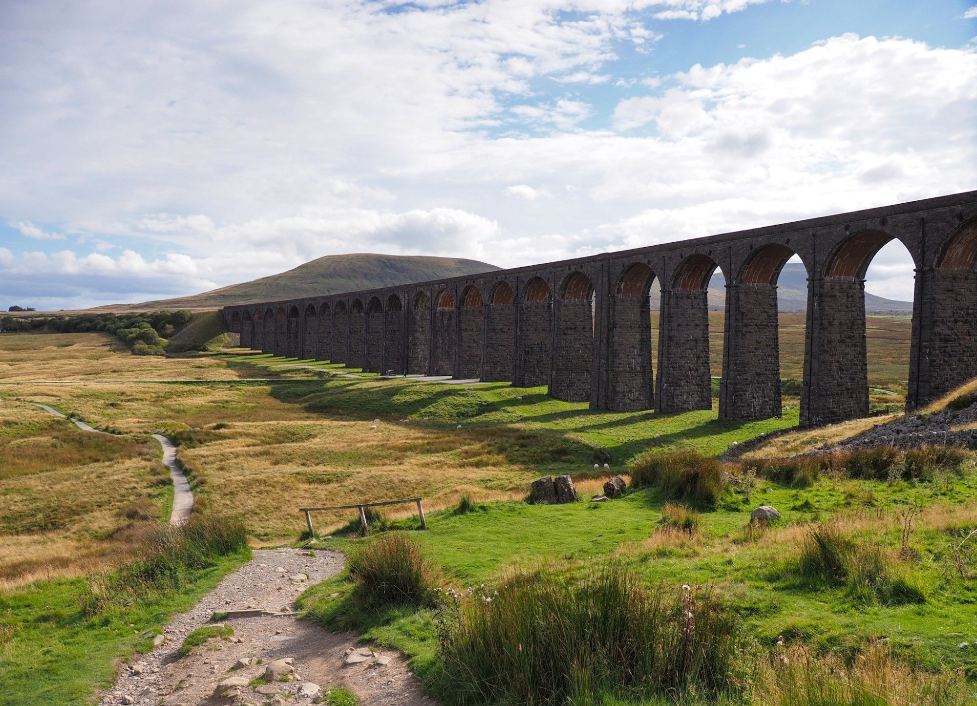 The huge viaduct, seen against the light from a slightly elevated position.