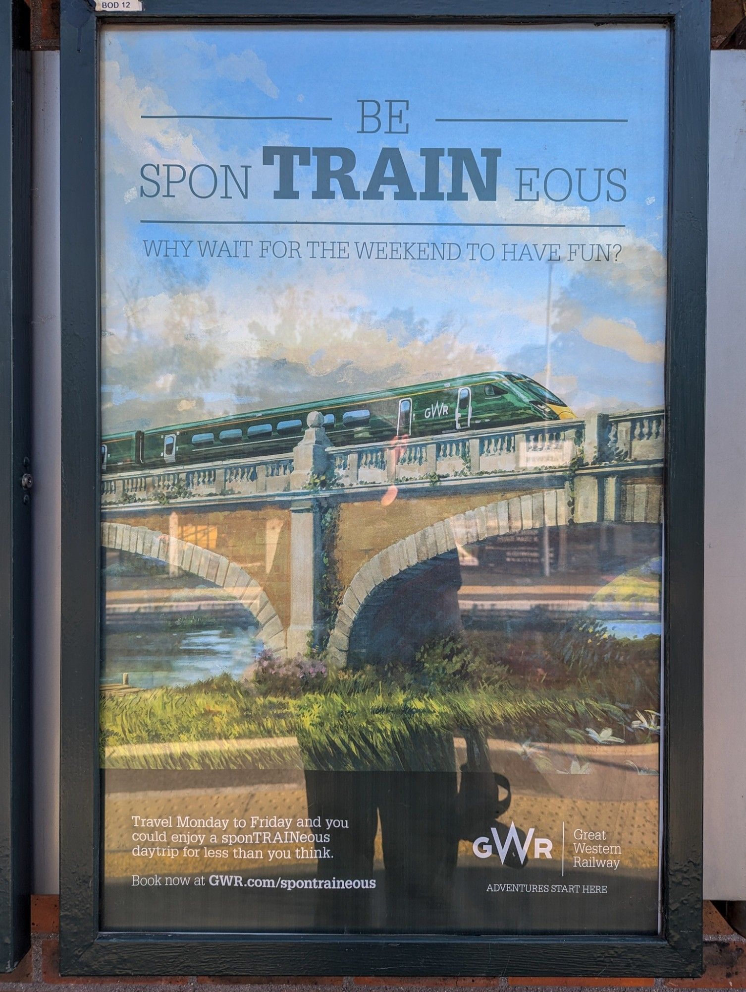 GWR poster «Be sponTRAINeous»: Painting of an IET crossing an old bridge.