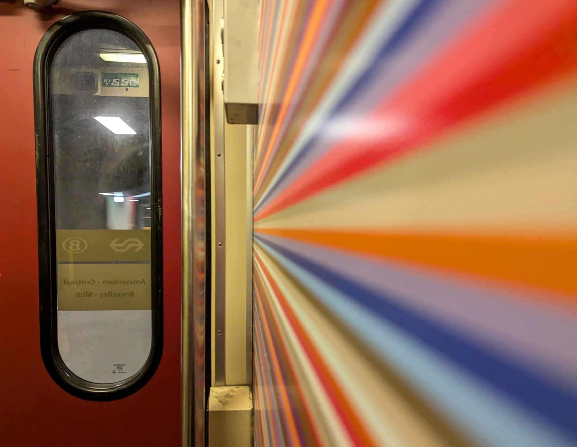 Artsy shot of the coloured lines on the vestibule walls of the IC carriages.