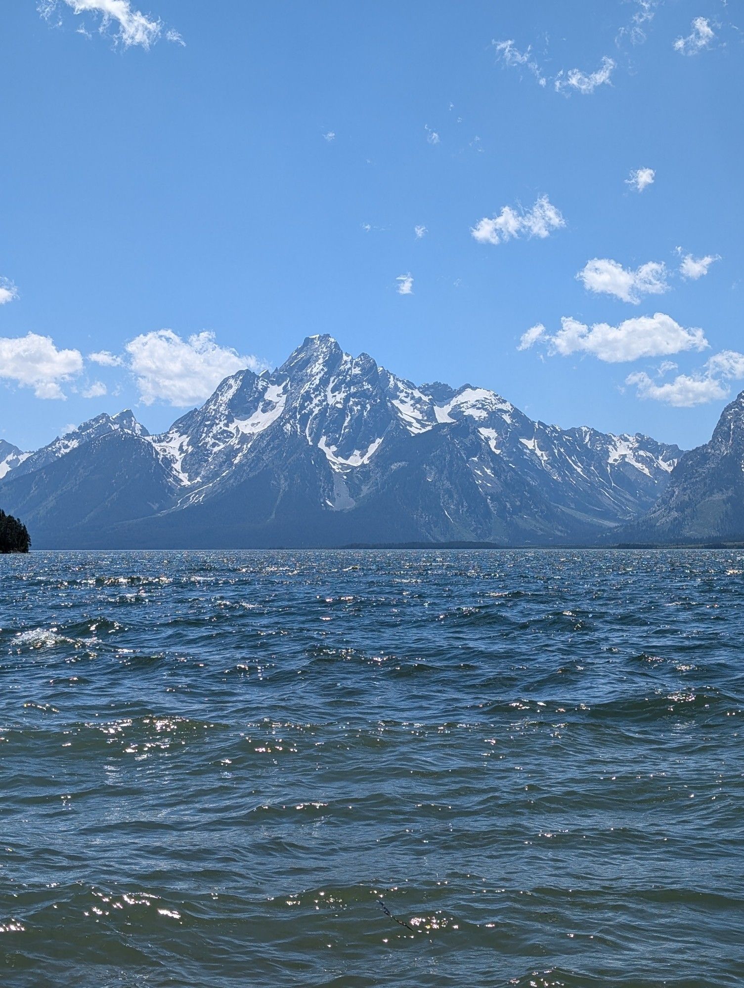 A photo of the Grand Tetons mountain range in Wyoming. Taken from the edge of Lake Jackson, which sits at the foot of the range.