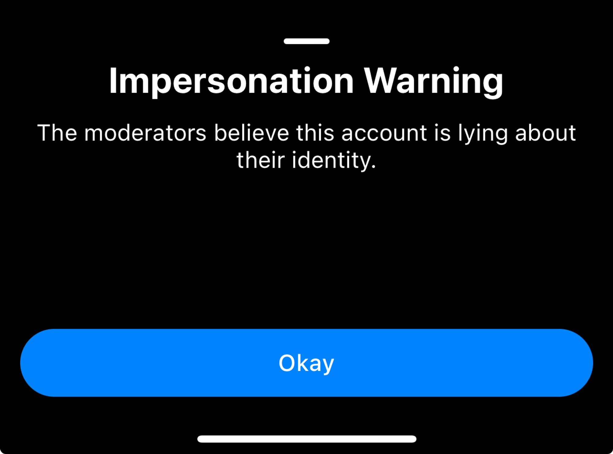 An impersonation warning found on the profile of Jordan B Peterson, who is a bad person and also just sucks.