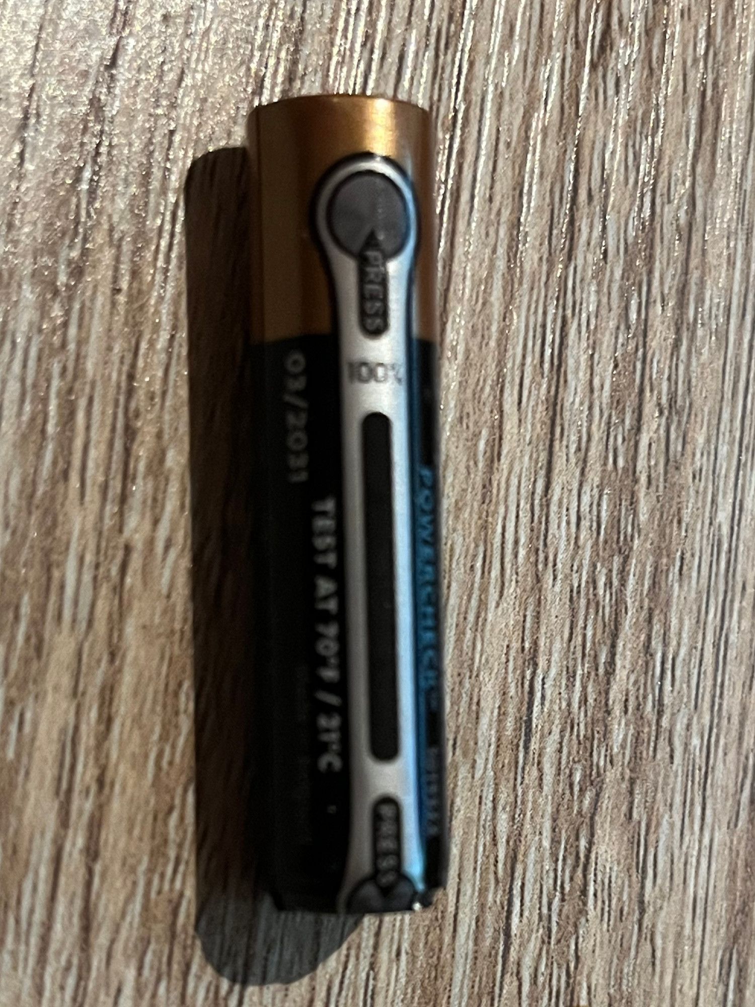 A Duracell battery with a built-in tester