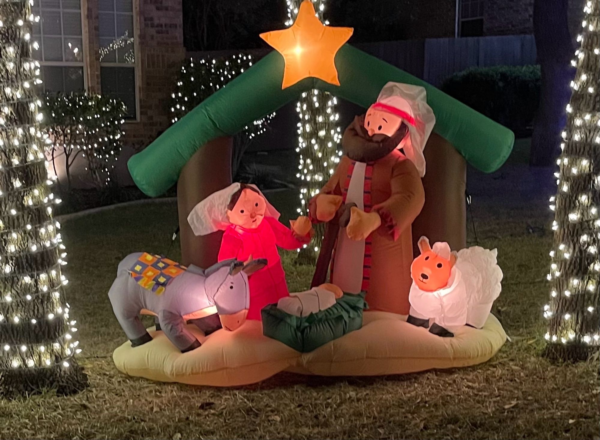 Inflatable Christmas decoration of the Christmas Manger scene, featuring a donkey that looks like Eeyore from the Winnie-the-Pooh stories.