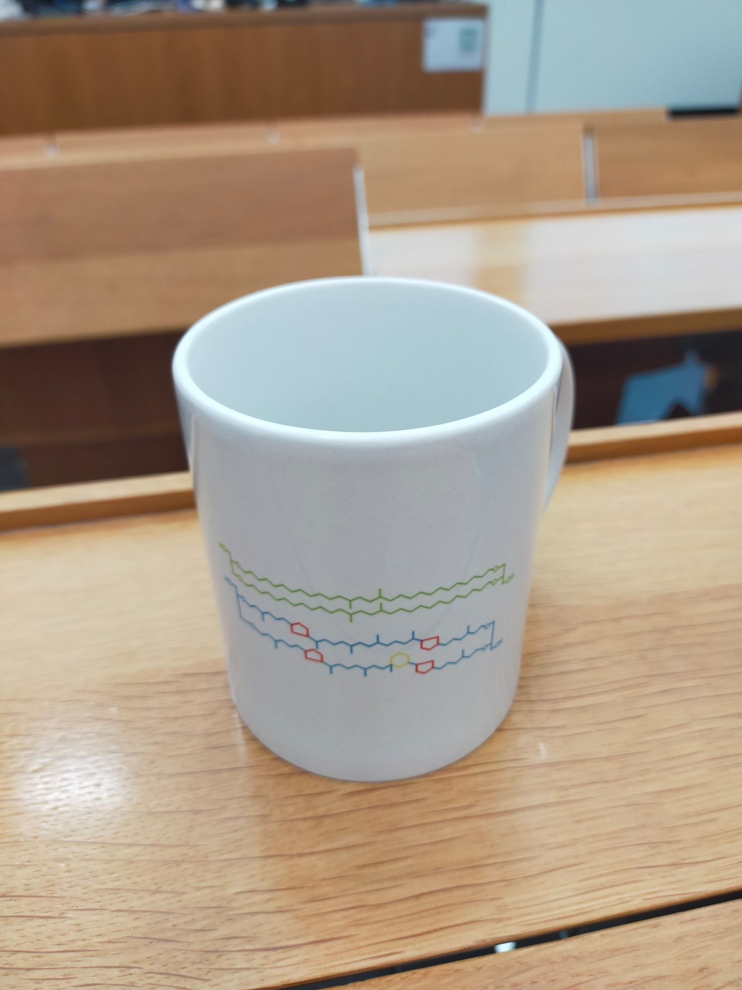 Nerdy mug with two membrane-spanning lipids on it. The molecule drawn in green is a bacterial membrane lipid whereas the molecule drawn in blue, red, and yellow is a famous archaeal membrane lipid named crenarchaeol.