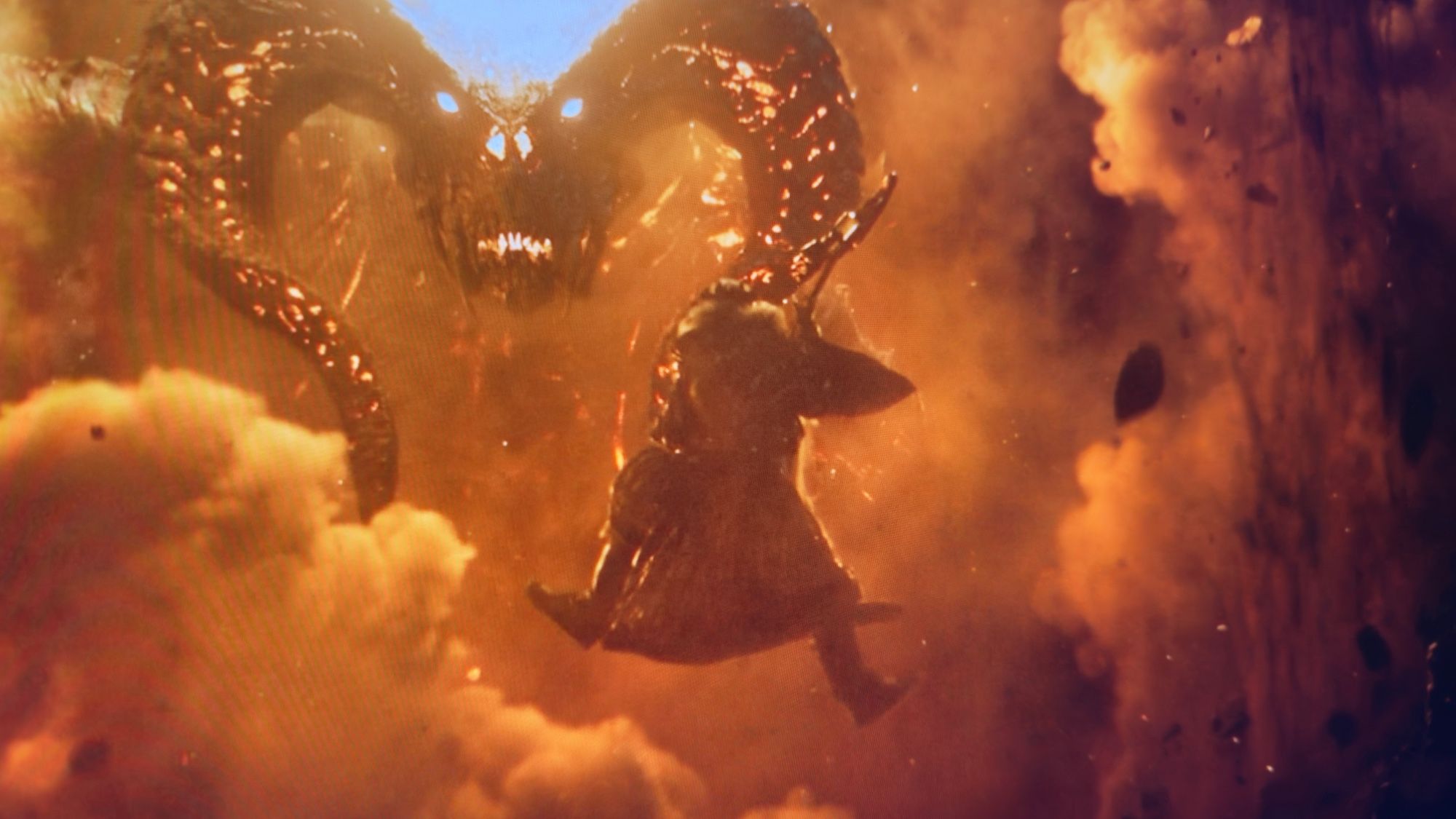 A screen grab from Rings of Power. King Durin leaping, with axe in hand, to attack the Balrog.