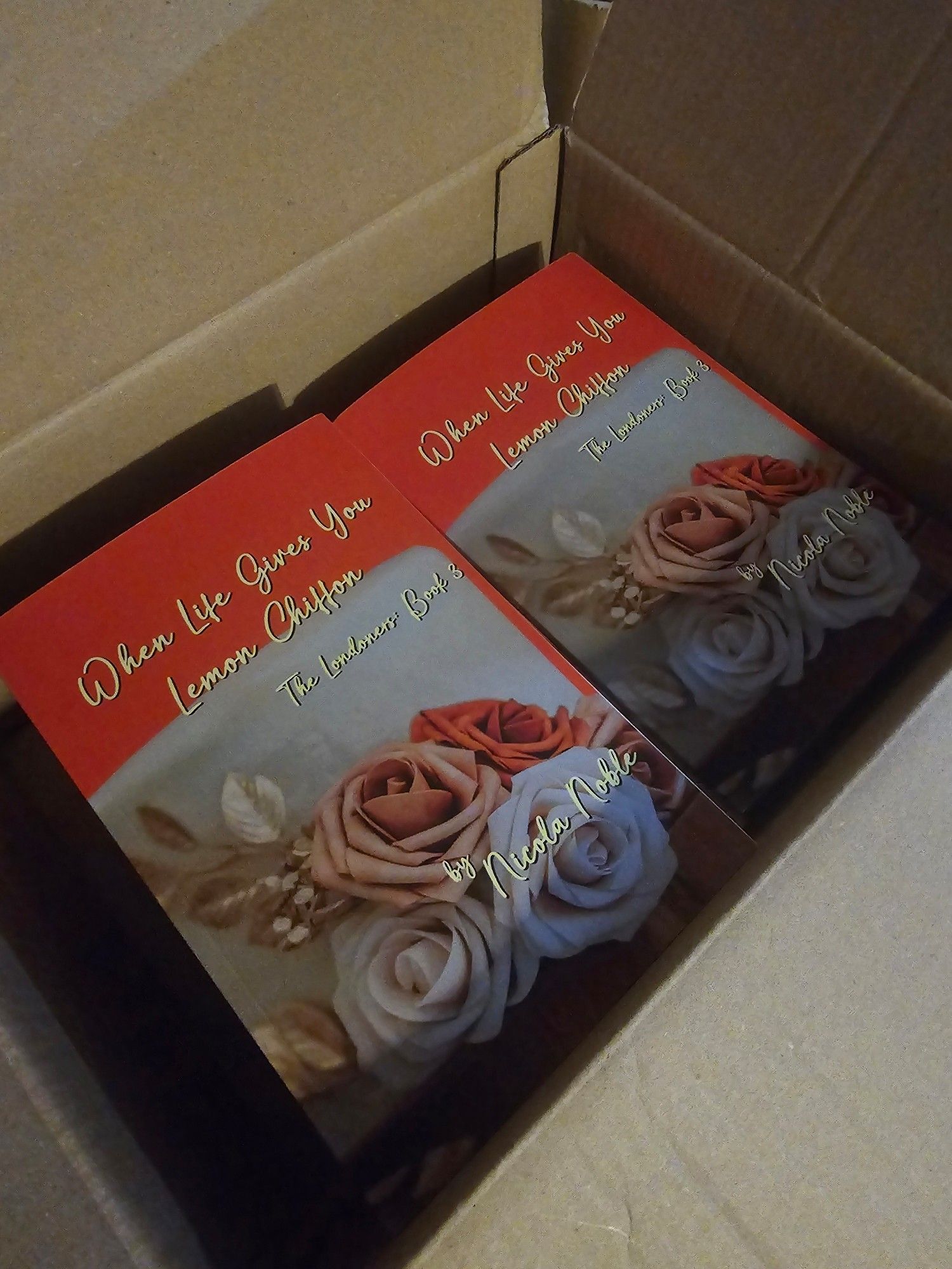 Copies of "When Life Gives You Lemon Chiffon".  Picture taken seconds after opening the box, so they are still in the box. Haha