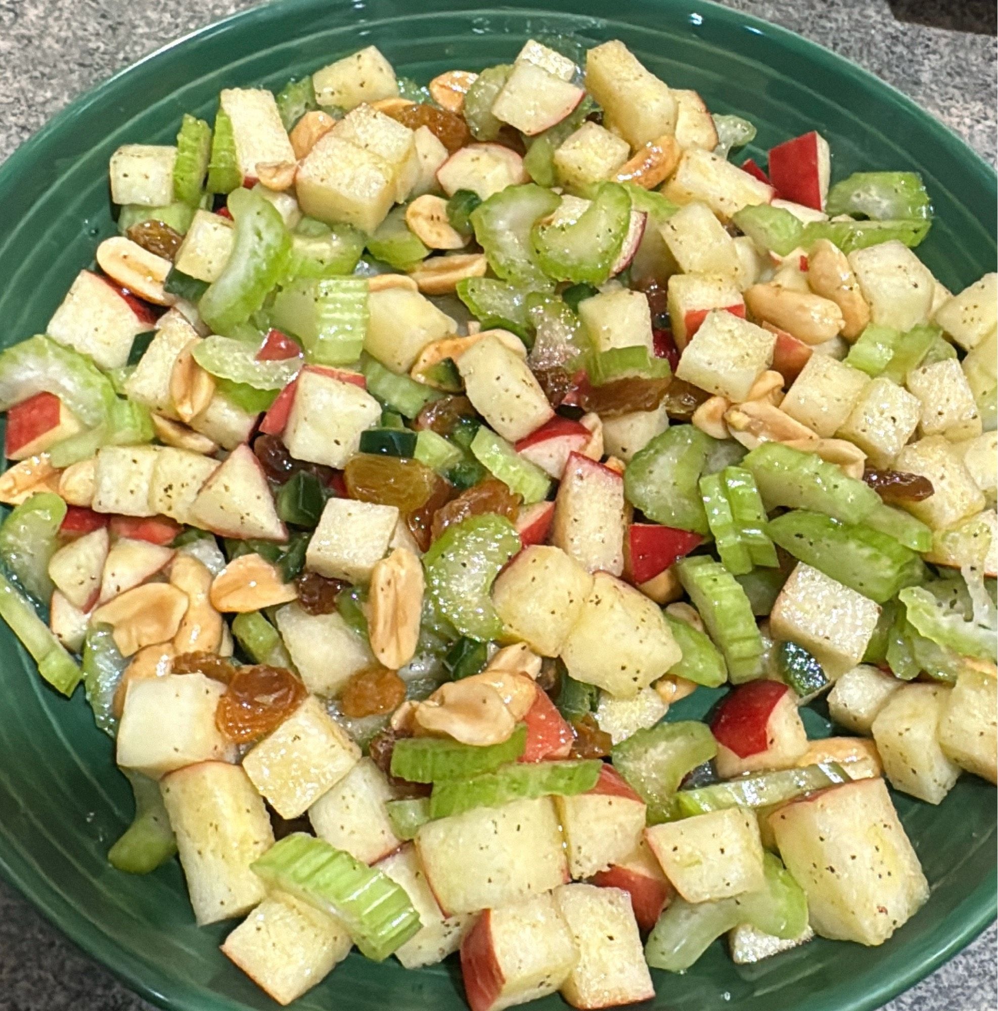 Celery, cosmic crisp apple, jalapeño, golden raisins, and peanuts, dressed with lemon juice, olive oil, salt, and pepper.