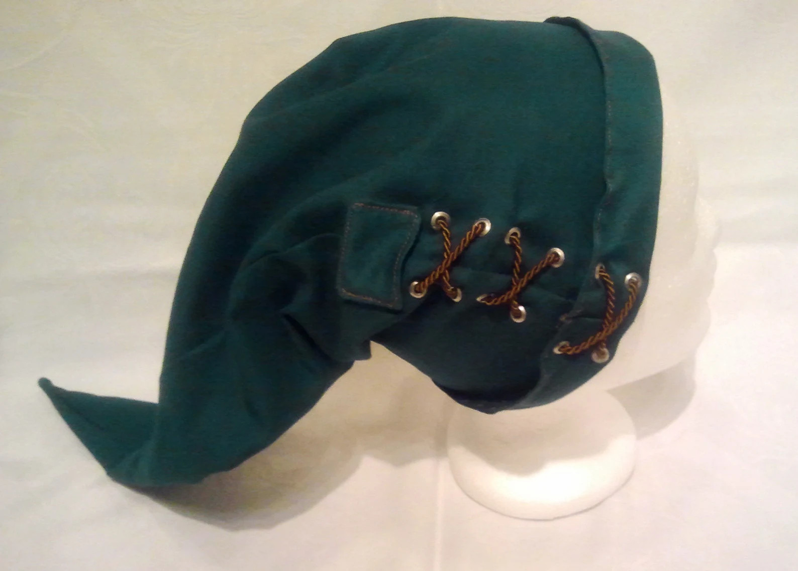 A Green hand made Legend of Zelda Lank at in Green, with X Stitching on the sides. 