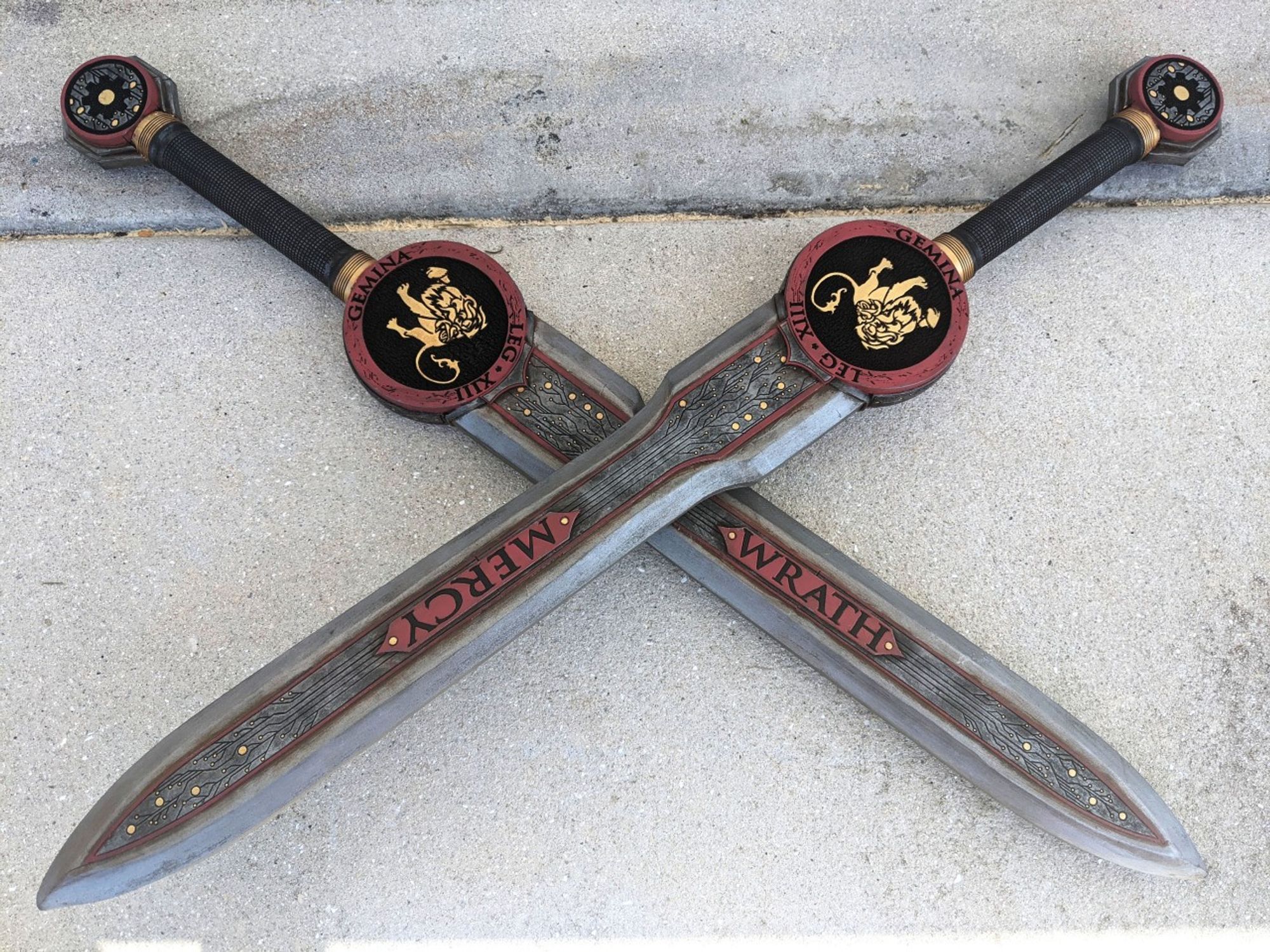 Two LARP Swords, one says MErcy, the other Wrath, with Lions on the cross guards.