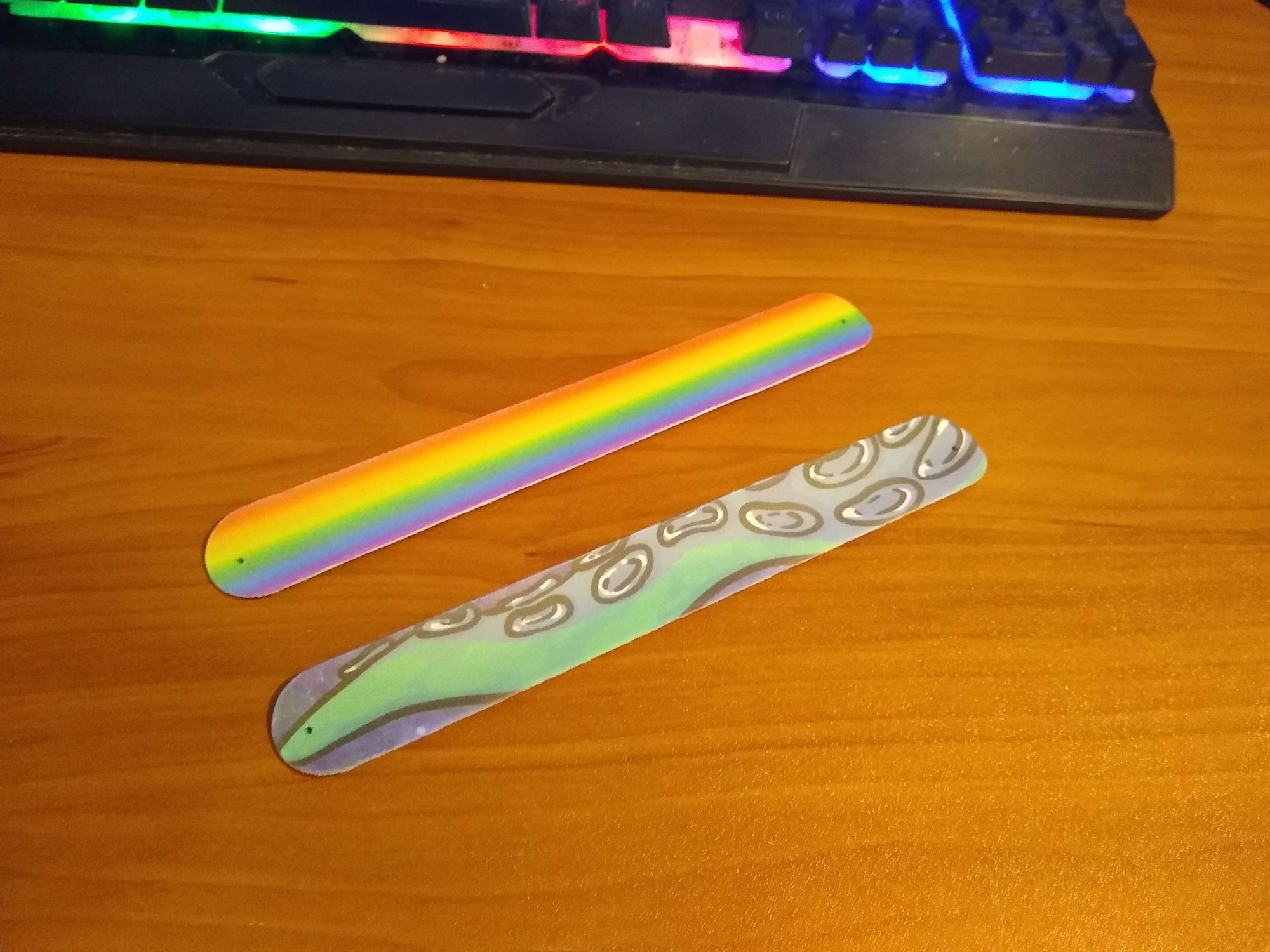 2 Slap Bracelets, one in Pride Colors the other a Green Tenta