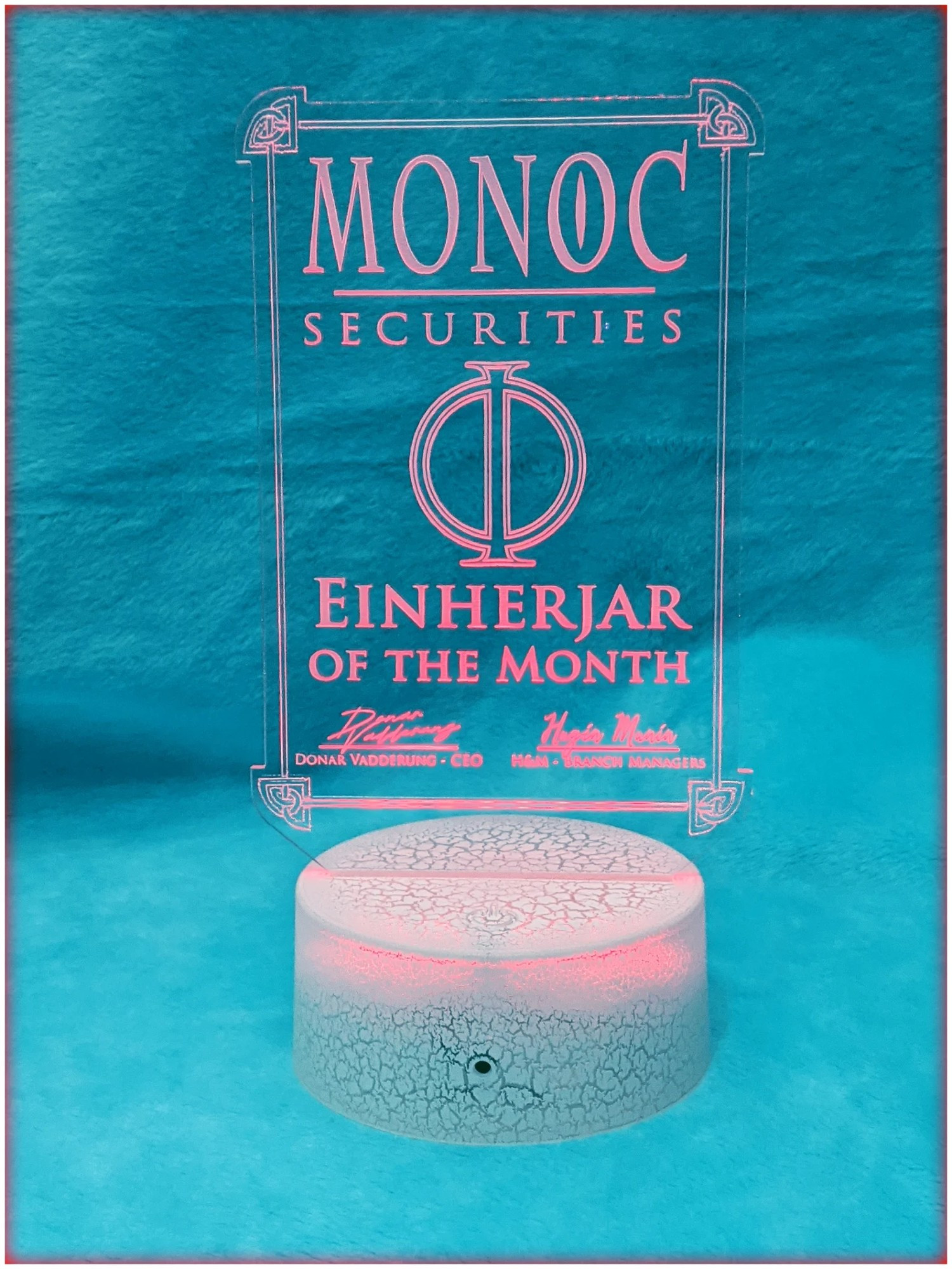 A light up display award. that reads from top to bottom
MONOC Securities Einherjar of the Month, Signed by Donar Vadderung CEO, cosigned by Hugin and Munin, Branch Managers