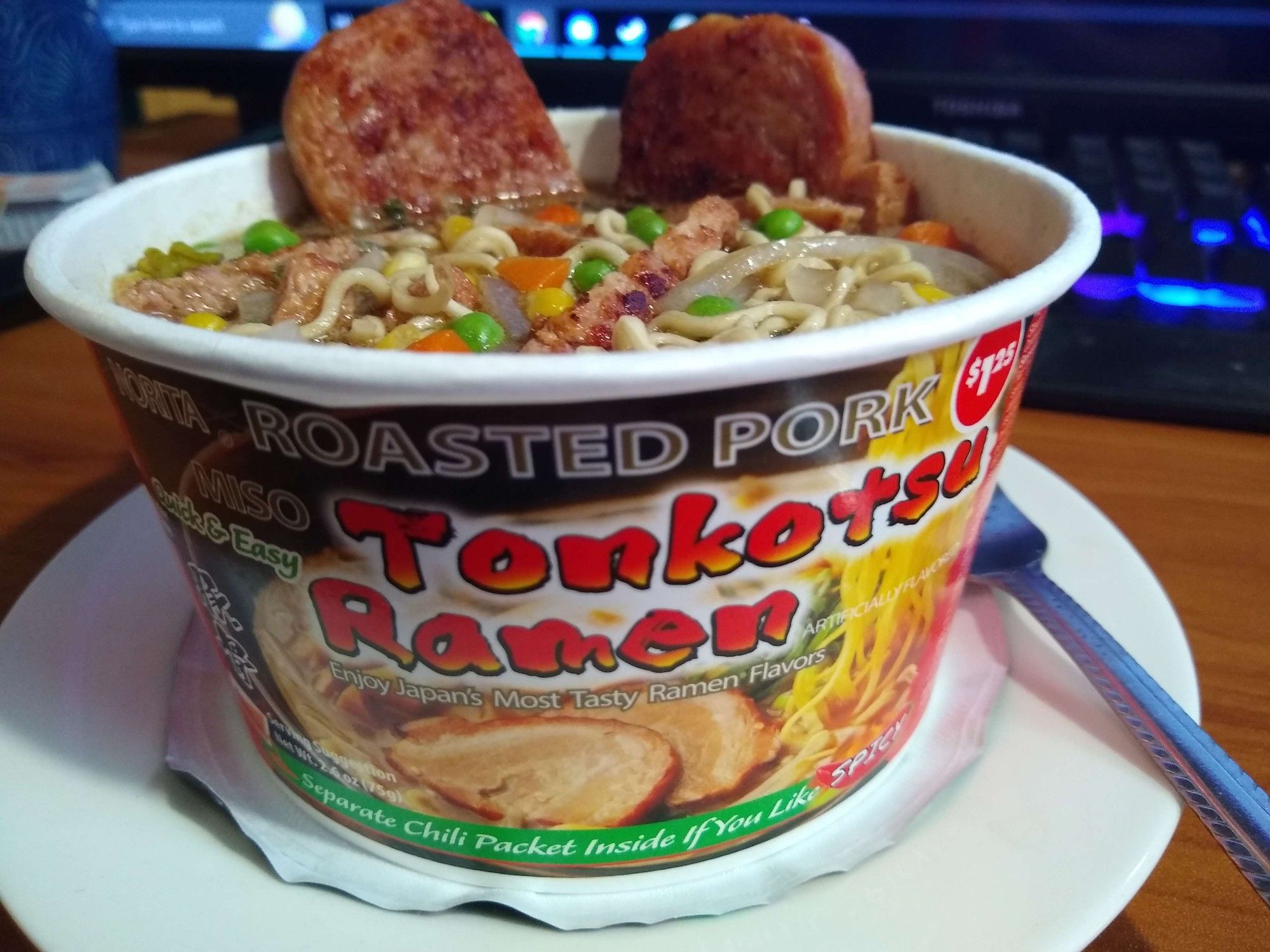 Instant Roasted Pork Tonkotsu Ramen with added peas carrots, corn, onion, and fried spam. 

A Bowl of Instant Ramen.