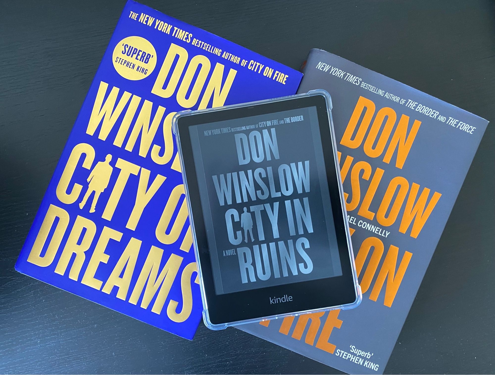 City in Ruins by Don Winslow on top of his other two books in this trilogy.