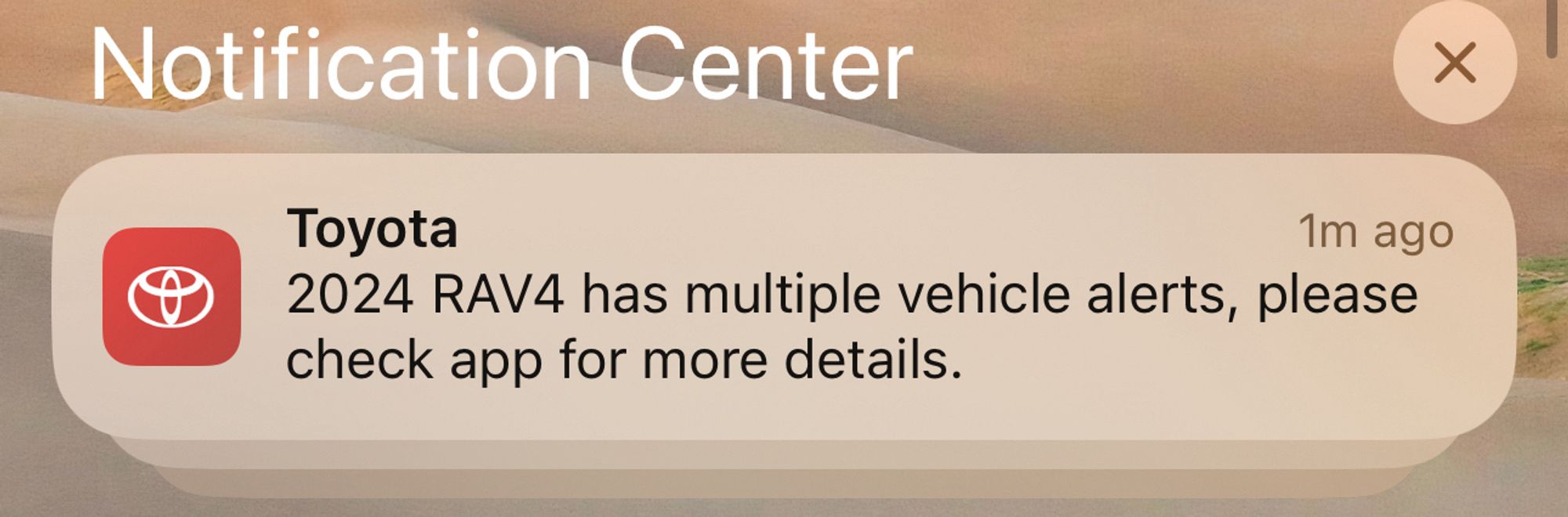 A phone notification that says “2024 RAV4 has multiple vehicle alerts, please check app for more details.