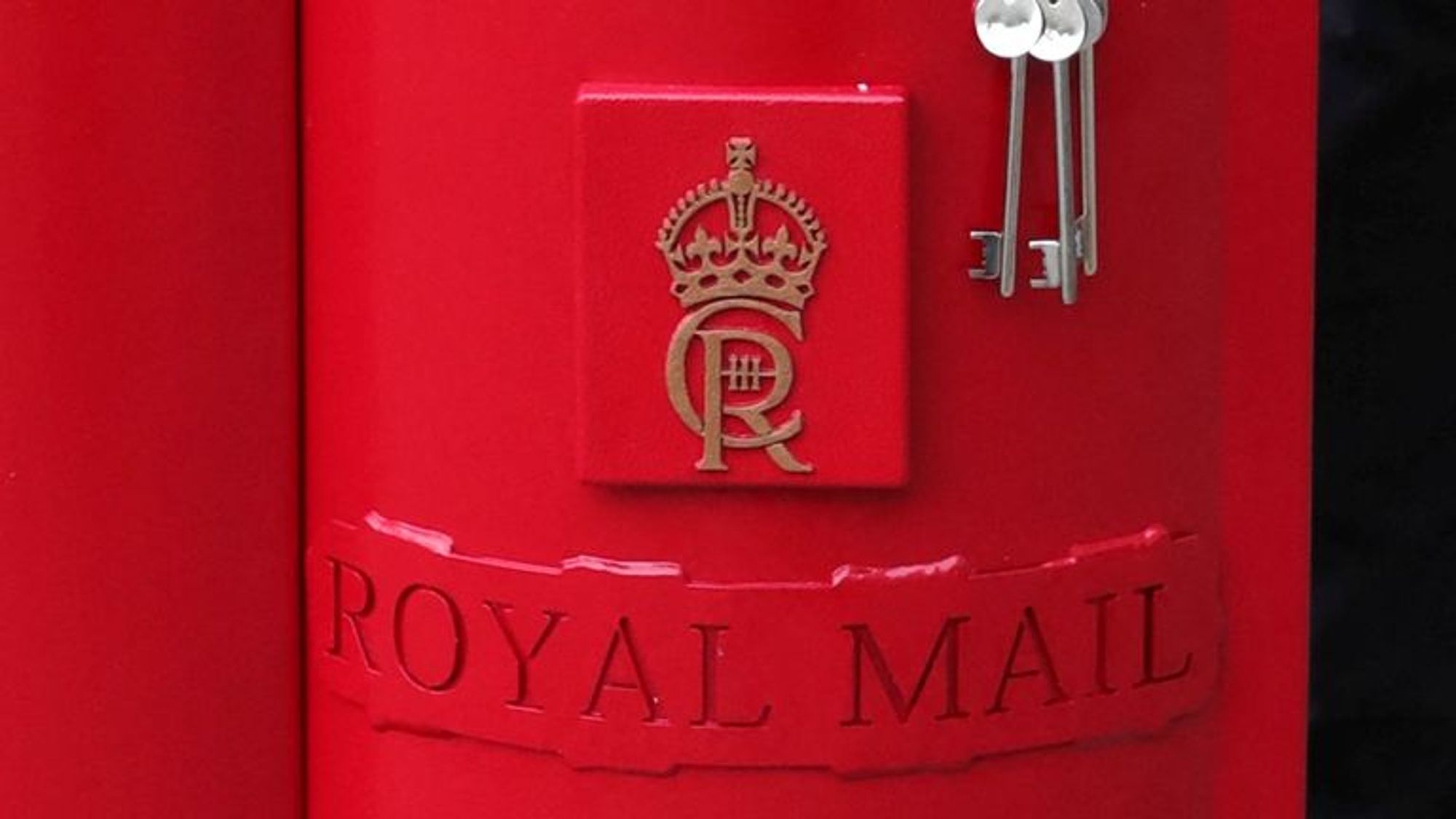 Royal Mail postbox with the current worthless idiot monarch's initials.