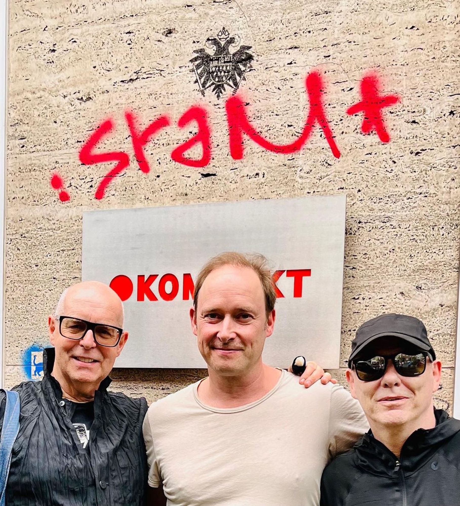 Michael Mayer of Kompakt Records posing with Neil Tennant and Chris Lowe of Pet Shop Boys in front of Kompakt Records in Köln