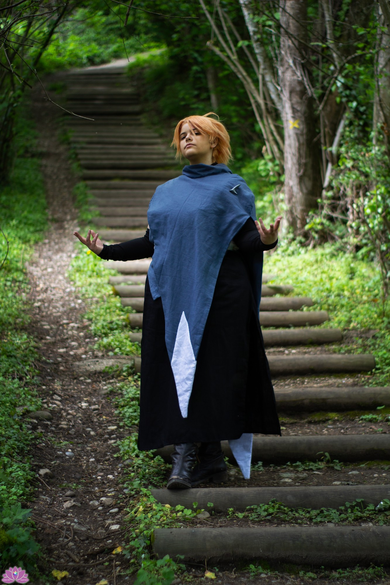 Illiane as Sypha Belnades from the Castlevania Netflix show, standing proudly in stairs in a wooden area 