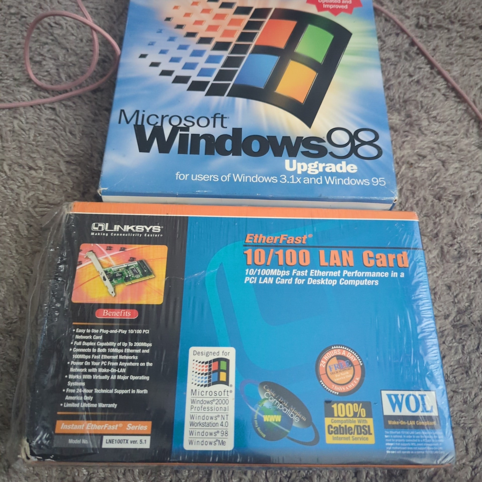 a picture of windows 98 se upgrade along with a network card for various 9x/2k systems