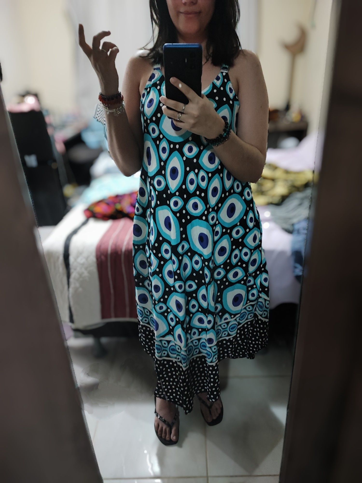 selfie in the mirror showing a dress covered in eyes.