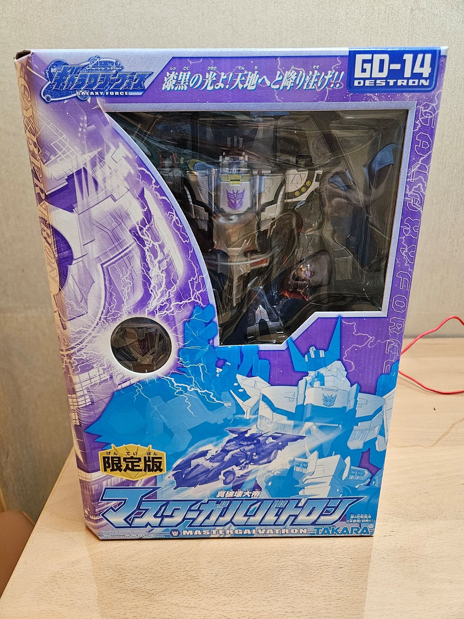 Galaxy Force Galvatron (in traditional Megatron colors) sealed in box on my dining room table