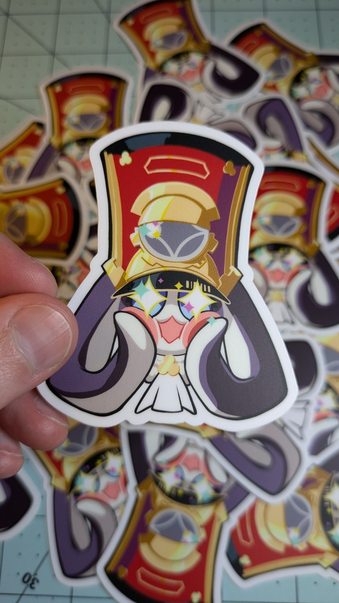 Pom pom, the interstellar train conductor that is also a bunny, squishing his own cheeks in excitement, as a sticker