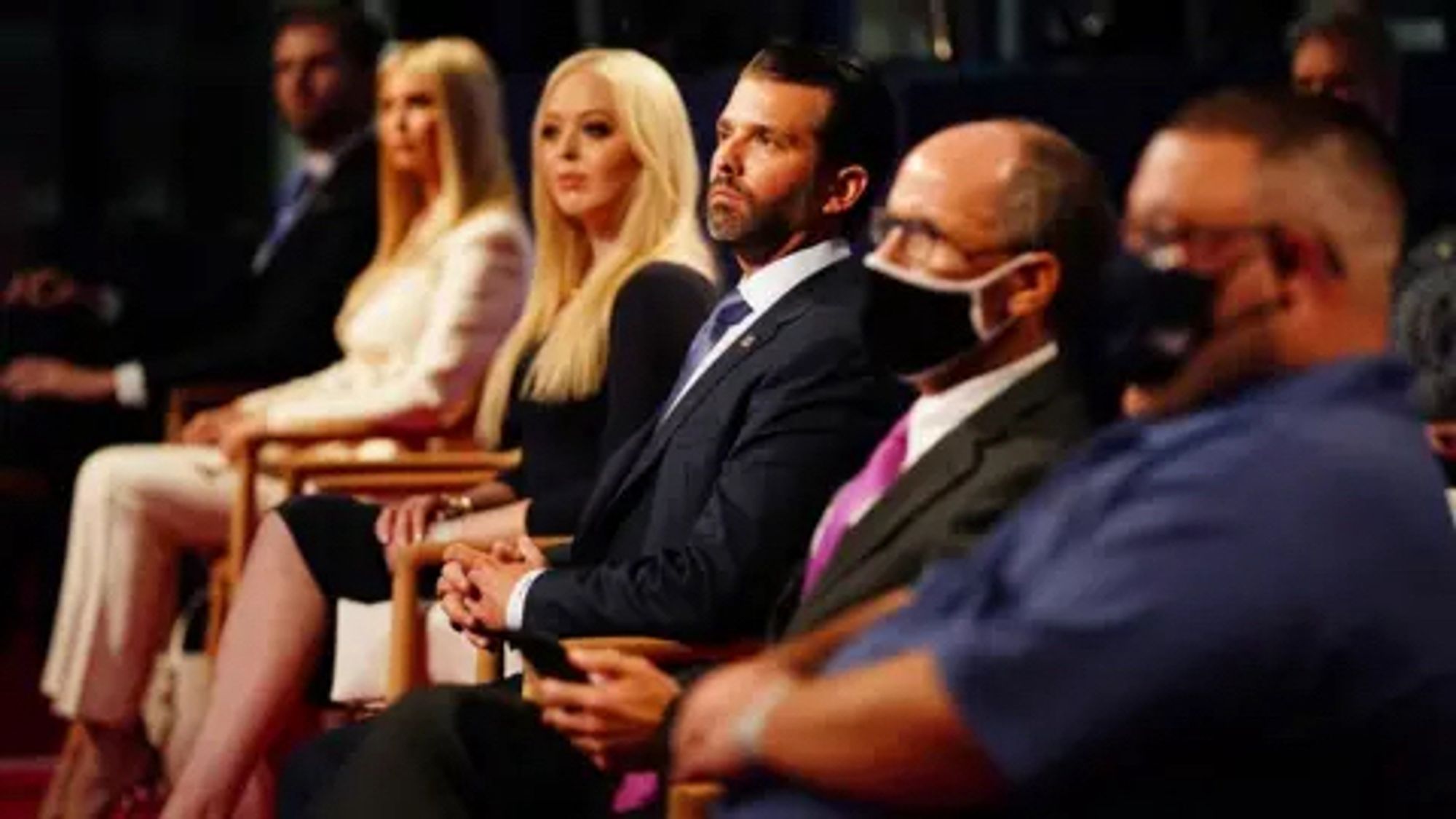 The Trump children - Eric, Ivanka, Tiffany, and Jr - sitting unmasked next to Rudy Giuliani and some other guy, who are wearing face masks.