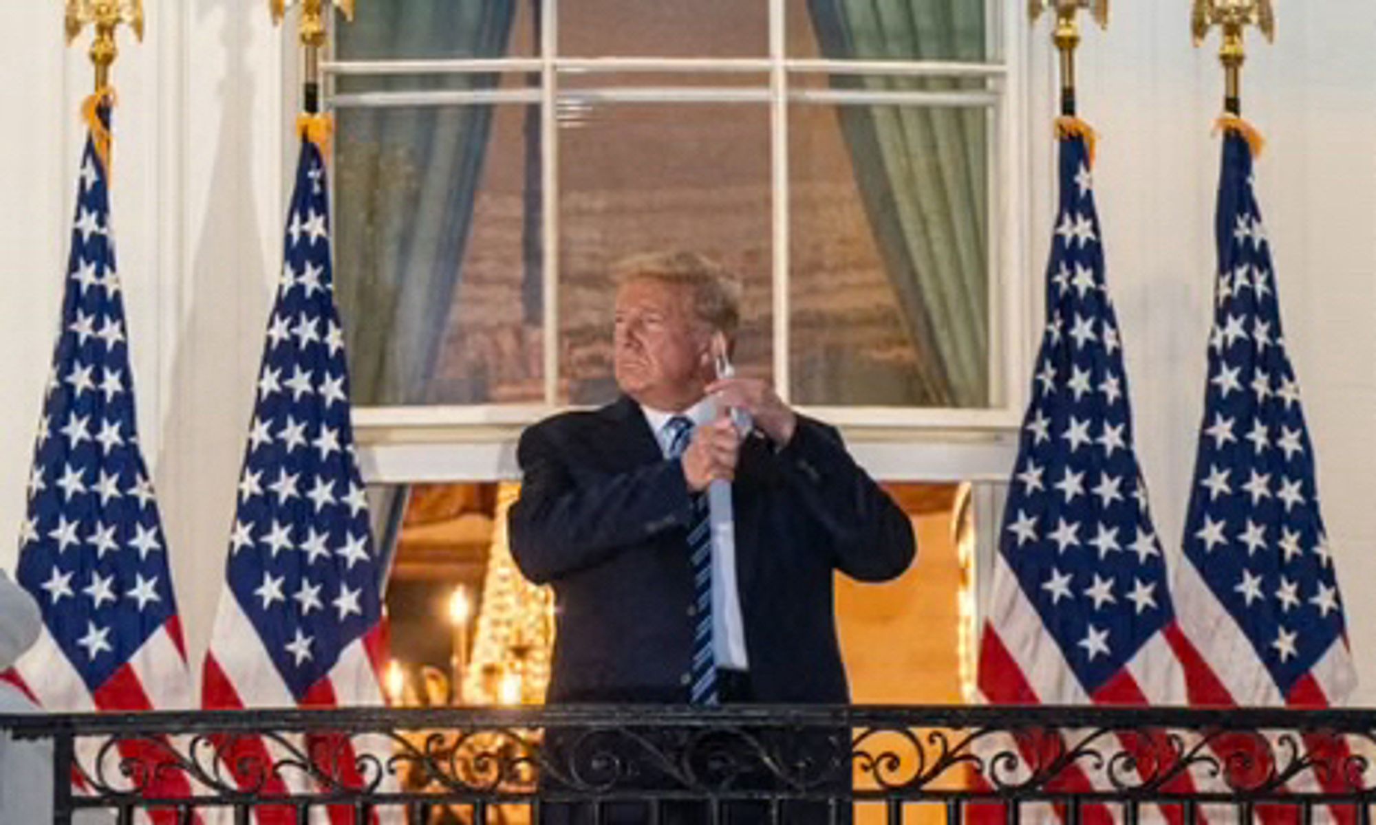 Trump on the Truman Balcony, removing his mask for the cameras