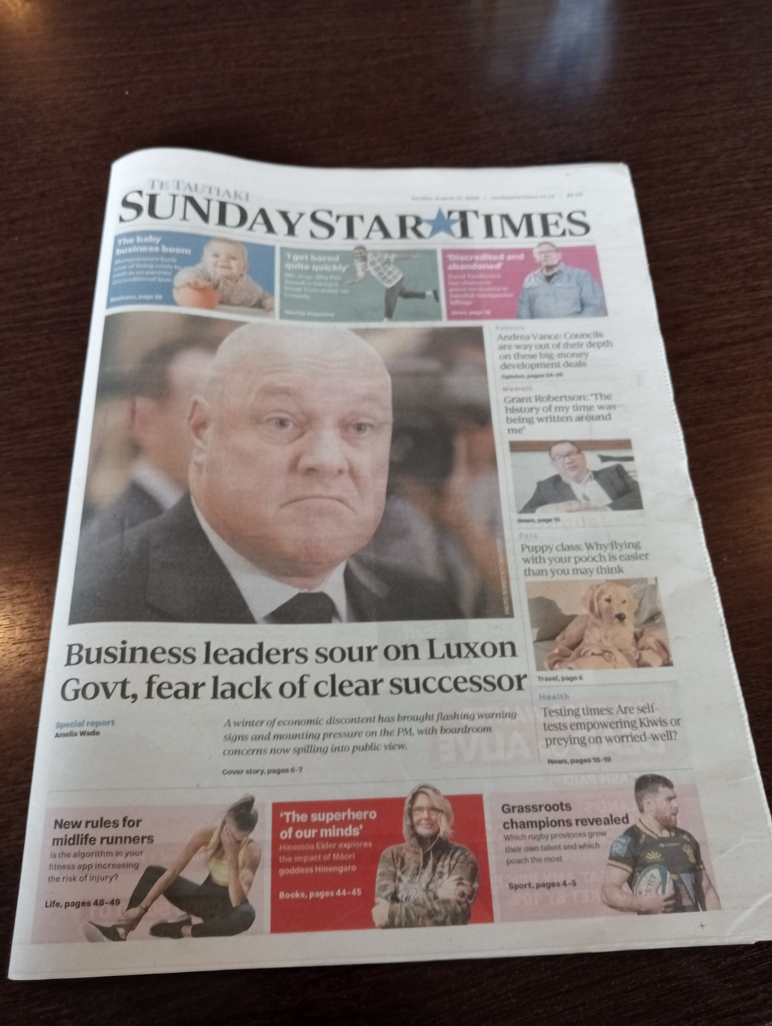 Photo of newspaper front cover, headline "Business leaders sour on Luxon Govt, fear lack of clear successor"