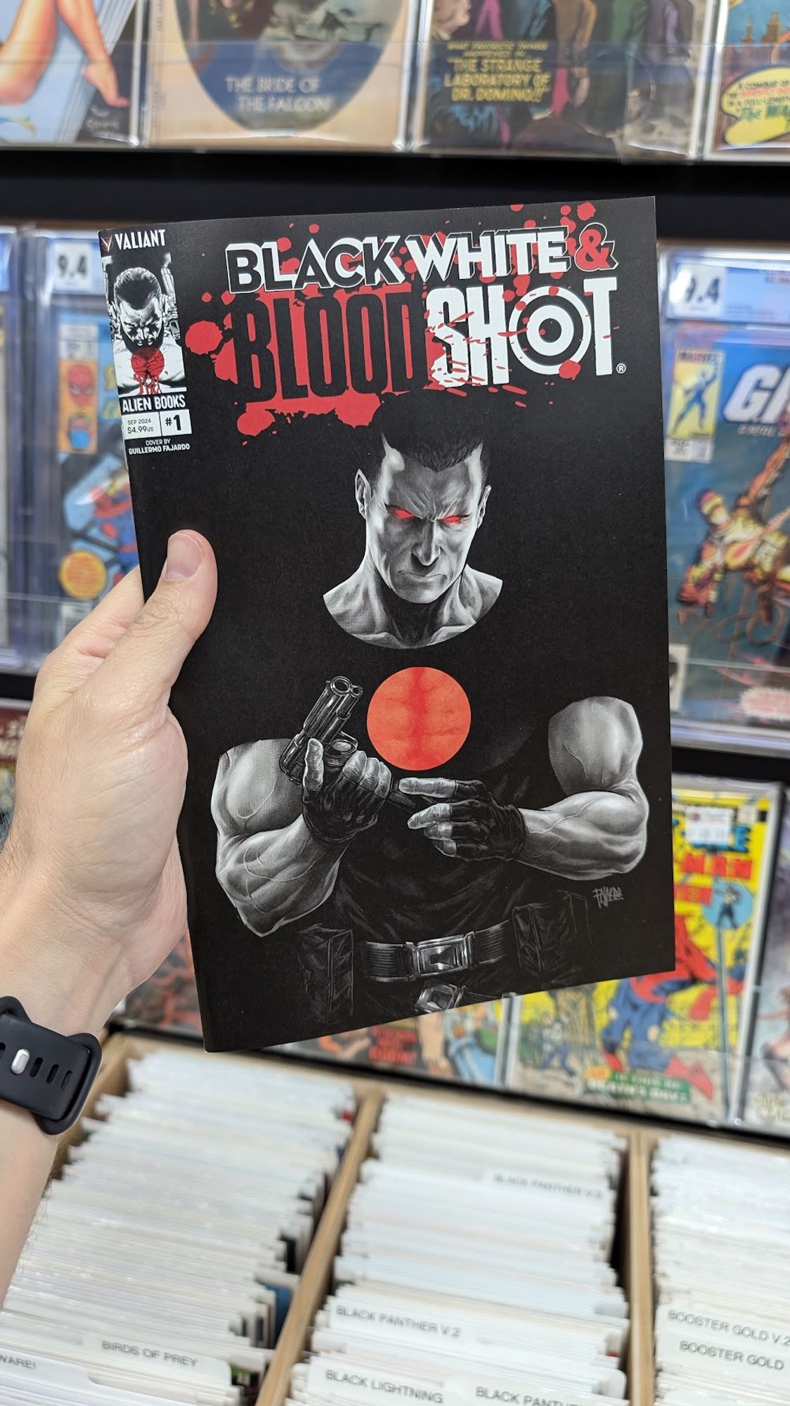 a hand holding a comic book featuring artwork of the Valiant Comics character Bloodshot