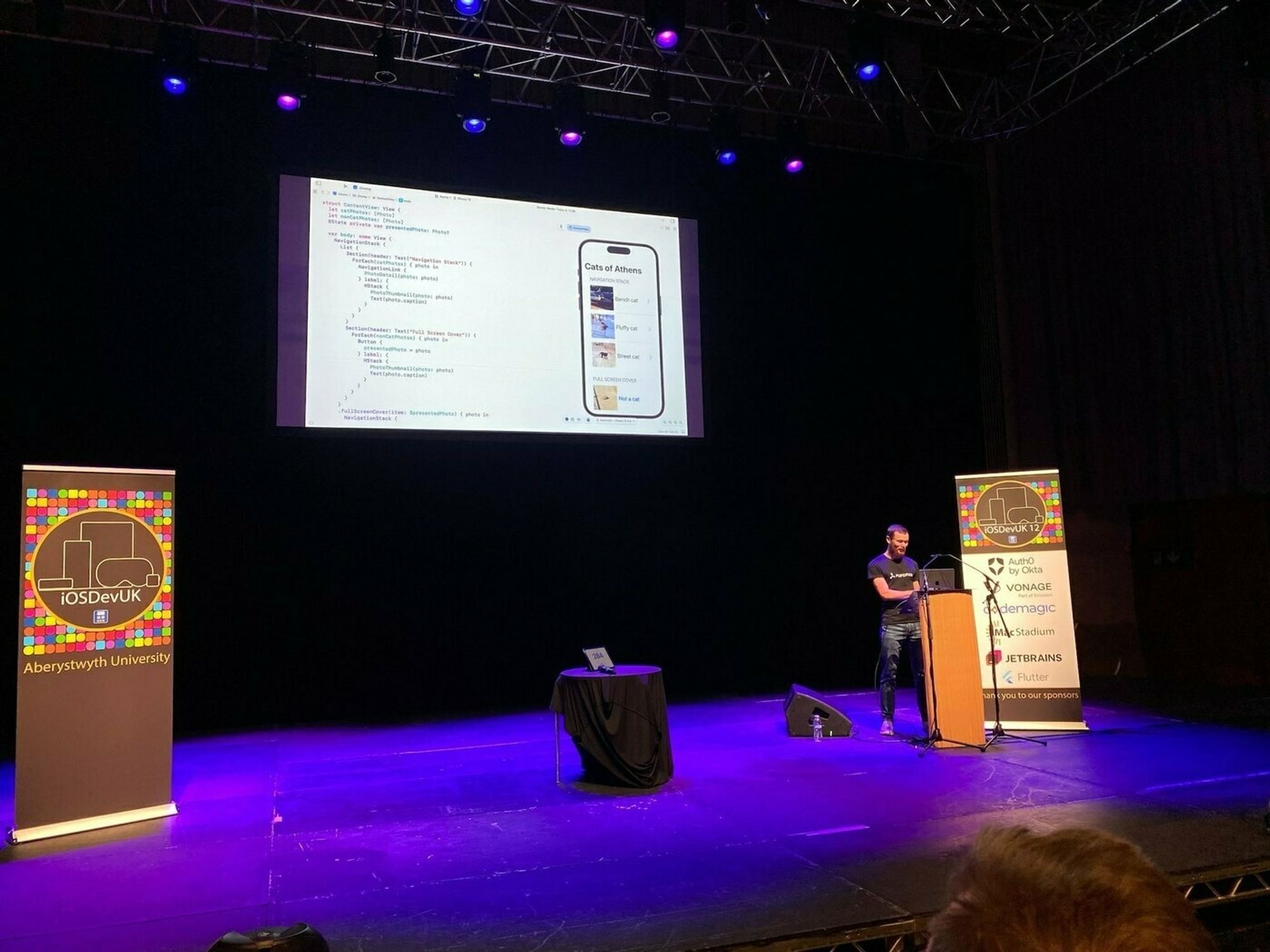 Photo of Douglas on stage at iOSDevUK