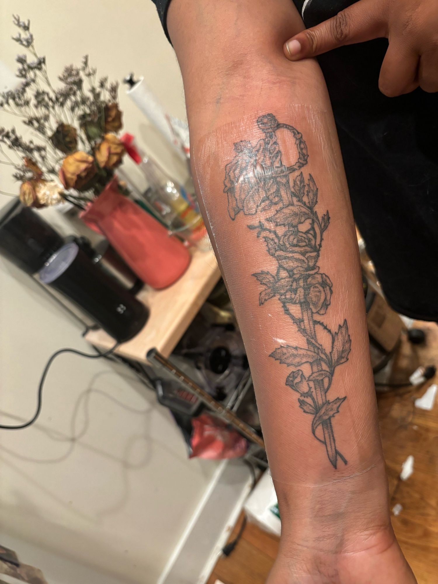 Tattoo of the sword of dios from utena covered in roses and thorns