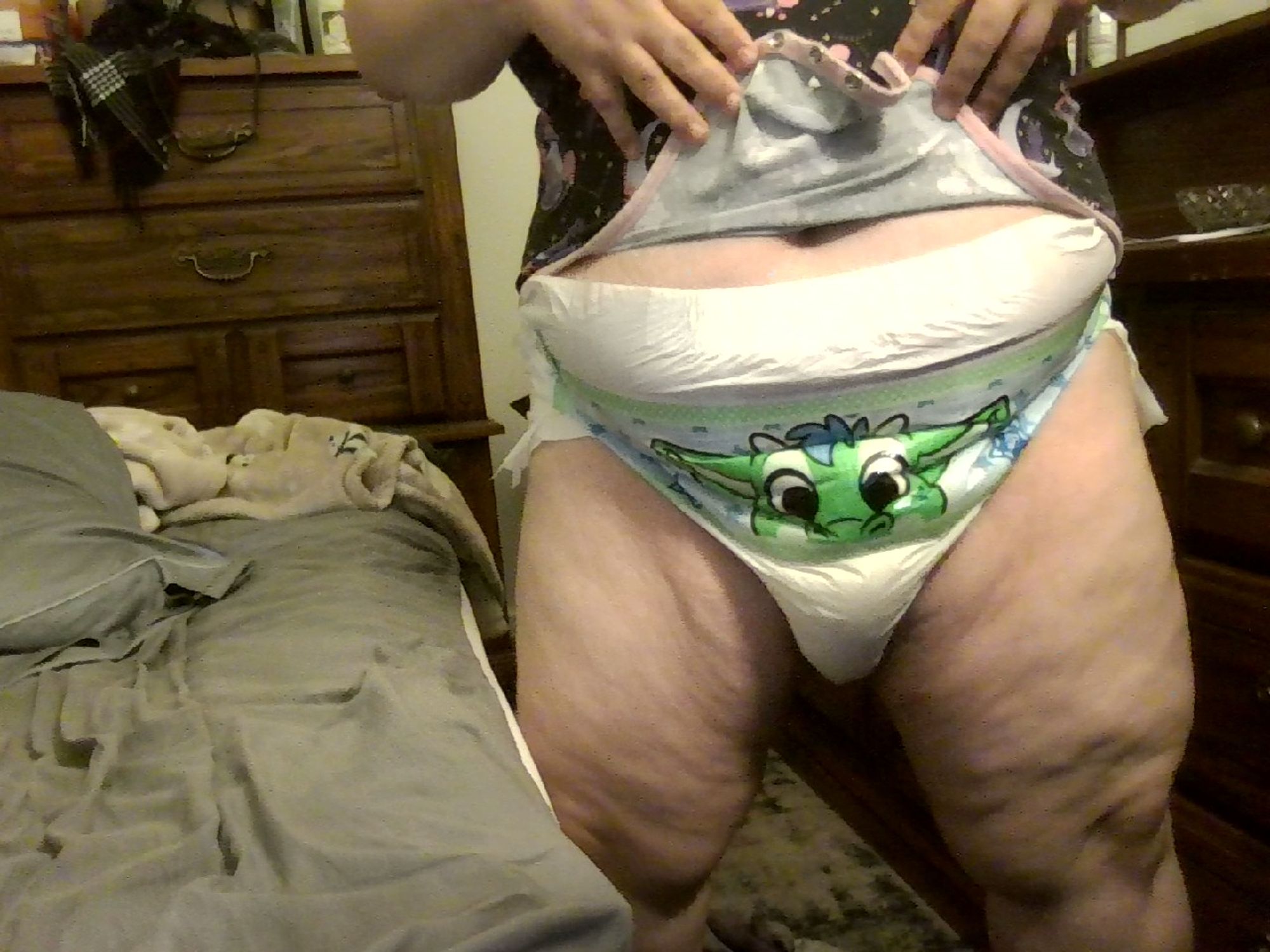 A picture of us showing off a very soaked Peekabu diaper