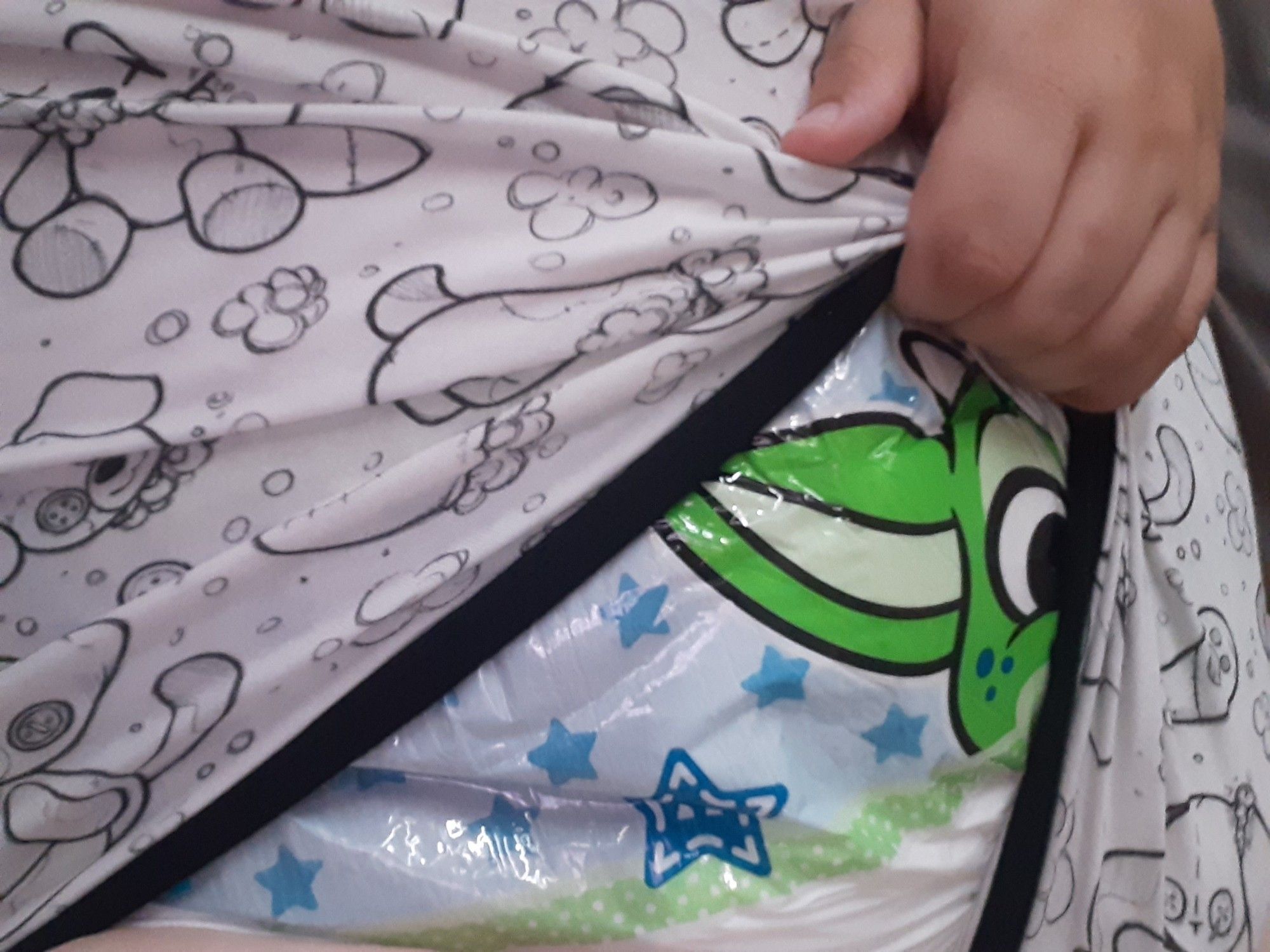 Peekaboo! Me lifting my onesie to show off a Peekabu diaper