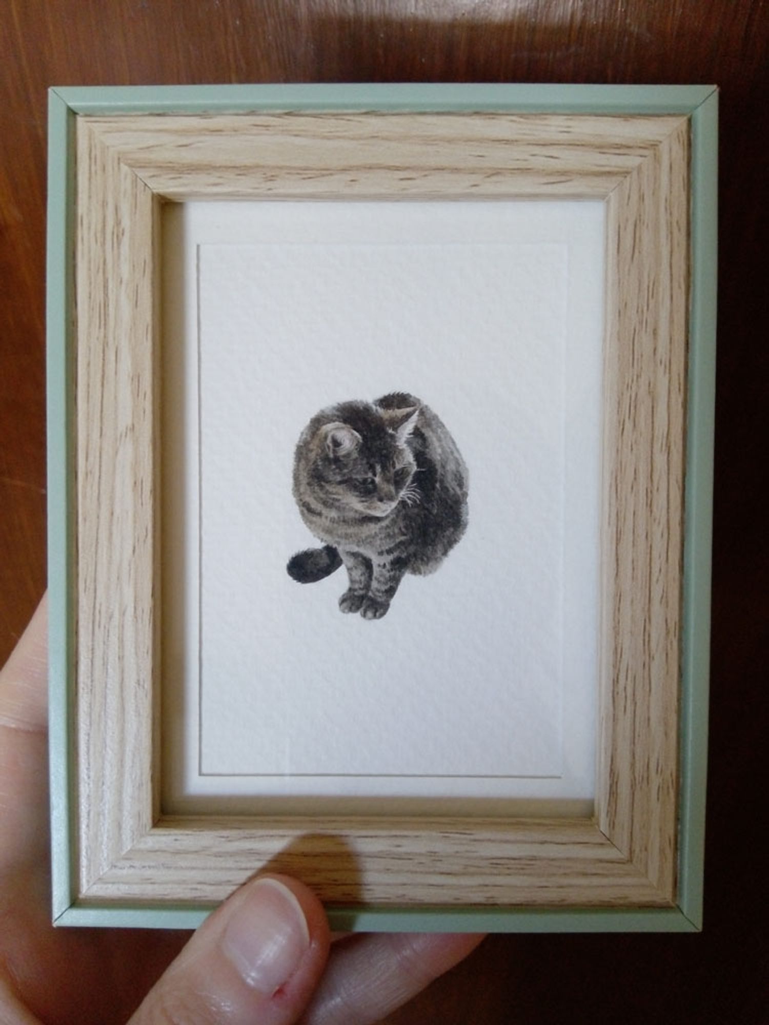 tiny cat watercolor in a tiny frame (the cat is 3*3.5cm and the frame is 9.5*12cm, including the edges)