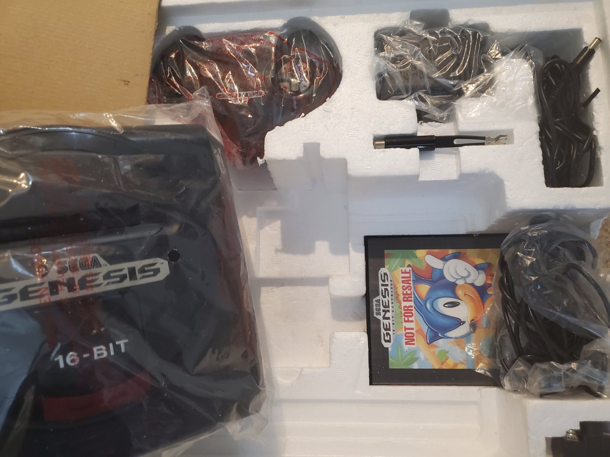 SEGA Genesis with Styrofoam packing with parts and games