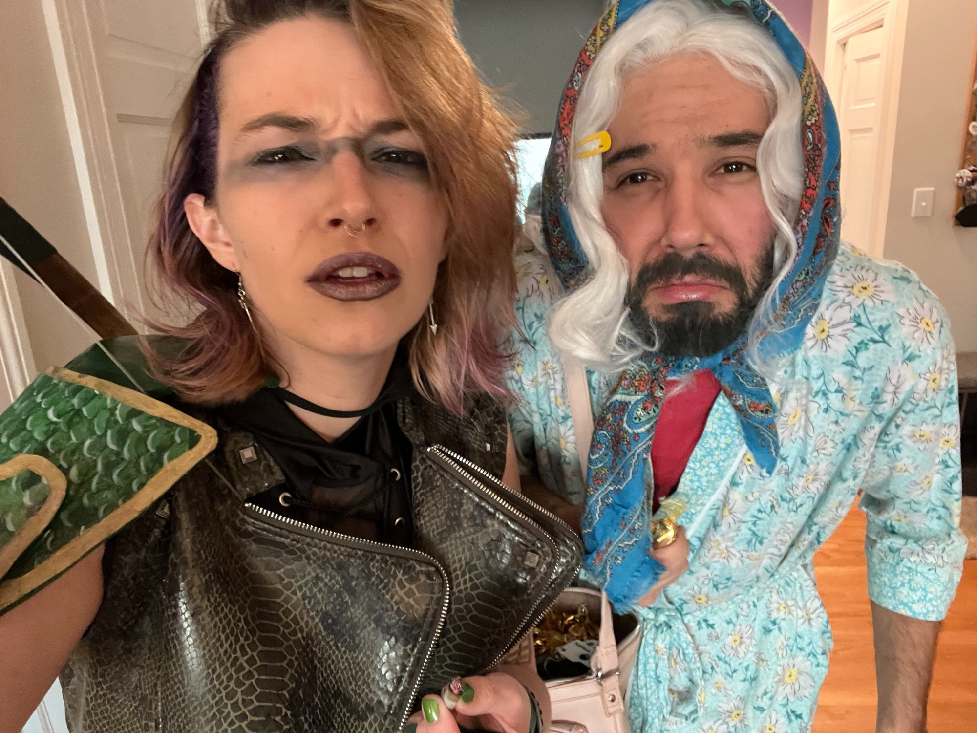 Claire, dressed as Egwene Kindleaf from Not Another D&D Podcast, stands next to Danny, dressed as Nana Kindleaf. They mean mug to camera. 