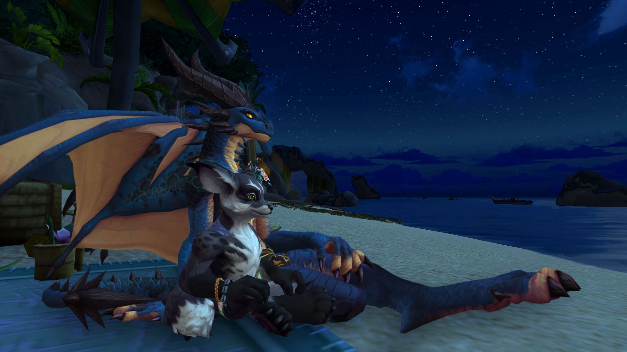 A Warcraft screenshot of a black furred vulpera with green eyes sitting close to a blue and gold scaled dracthyr with gold eyes, sitting at the beach of a tropical islandat nighttime, gazing out over the ocean together with stars glittering overhead. They are sitting so close they're touching and they are oh so gay.