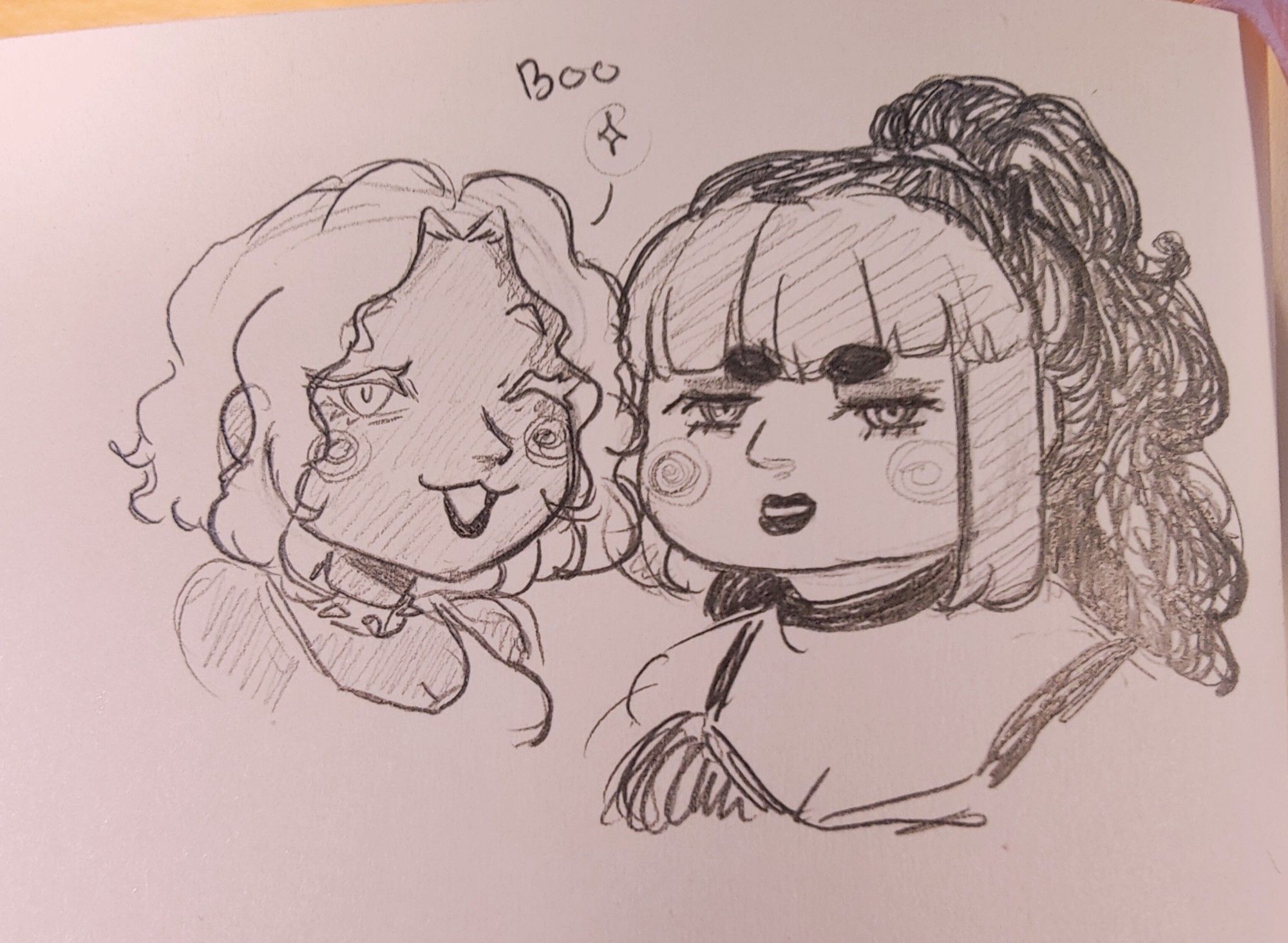 A pencil doodle of two of my OCs, Victoria and Jen. Victoria has white wavy hair and eyelashes, as well as tan skin, and she's winking at the viewer. Jen has dark curly hair with straightened, different colored bangs and pale skin, and she's looking towards the viewer with less enthusiasm.