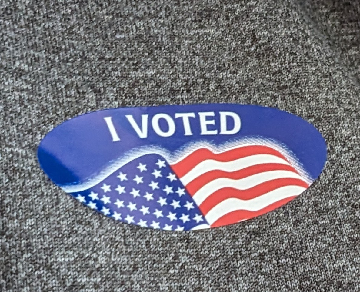 Sticker that says I VOTED with an American flag