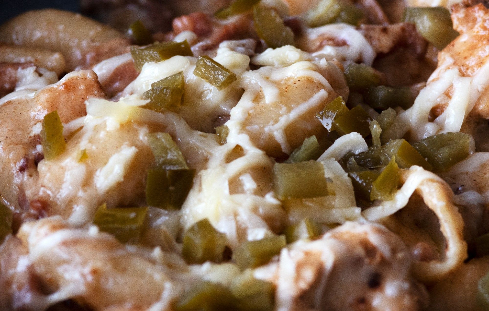 Chunks of chicken and bacon topped with diced jalapenos and melted cheese