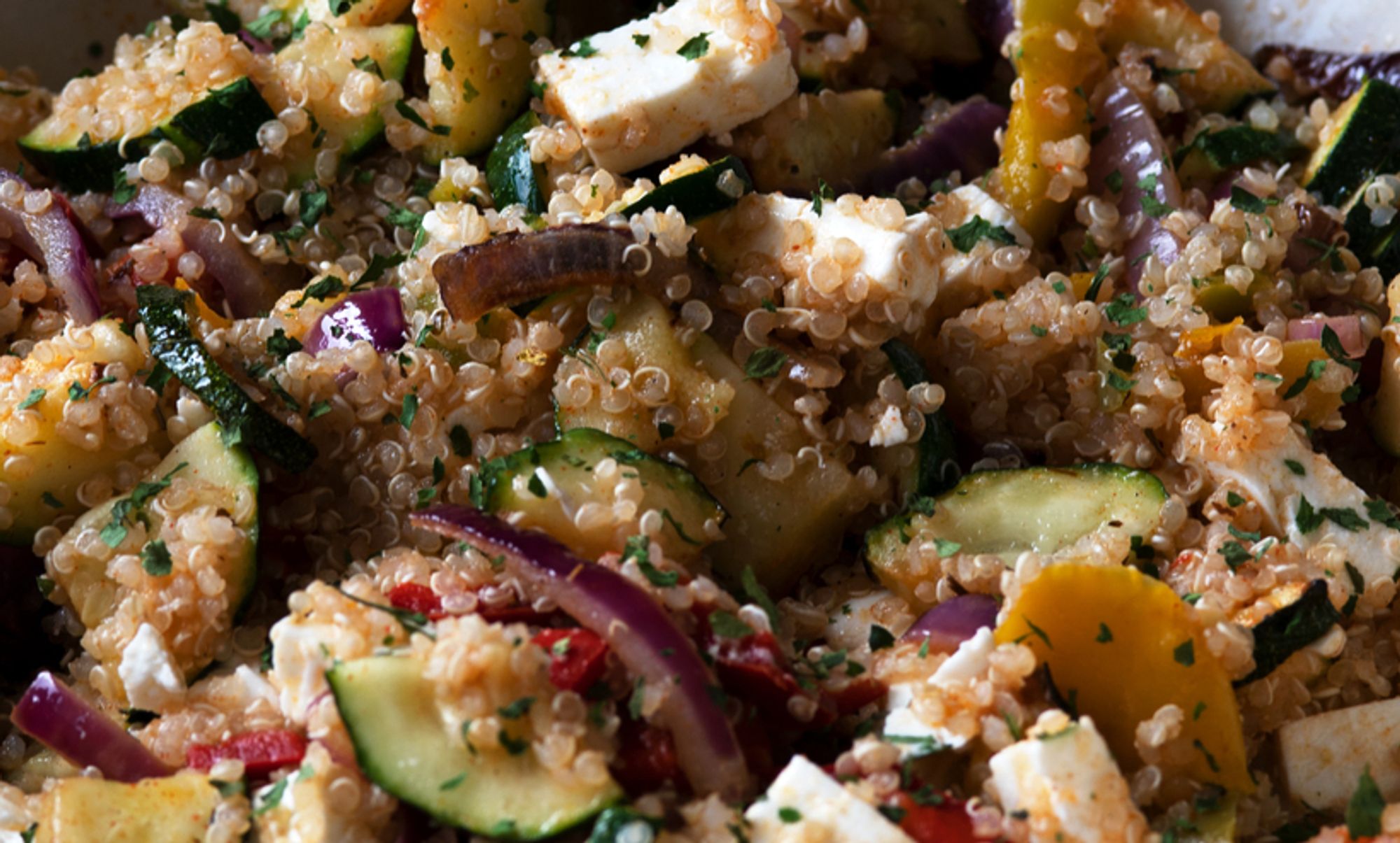 Quinoa with various diced vegetables, feta cheese and herbs