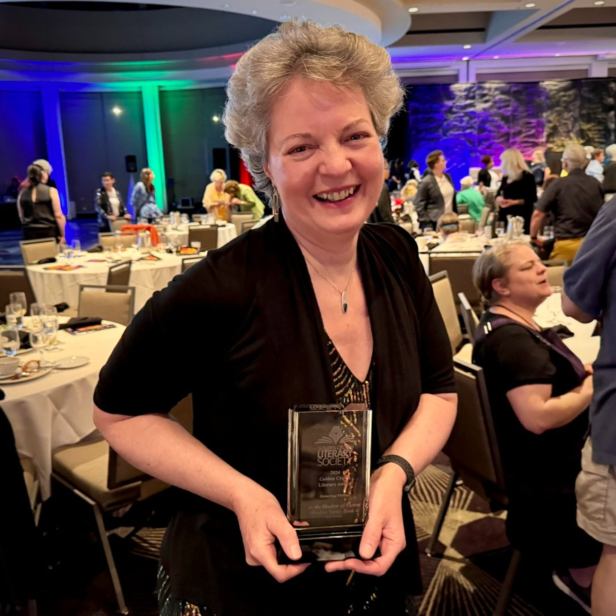 Author J.E. Leak at the awards ceremony with her Golden Crown Literary Society award for Historical Fiction.