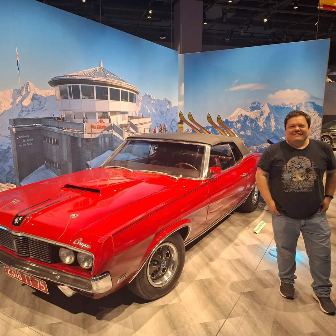 Your humble author, posing next to Tracy's Mercury Cougar from OHMSS.