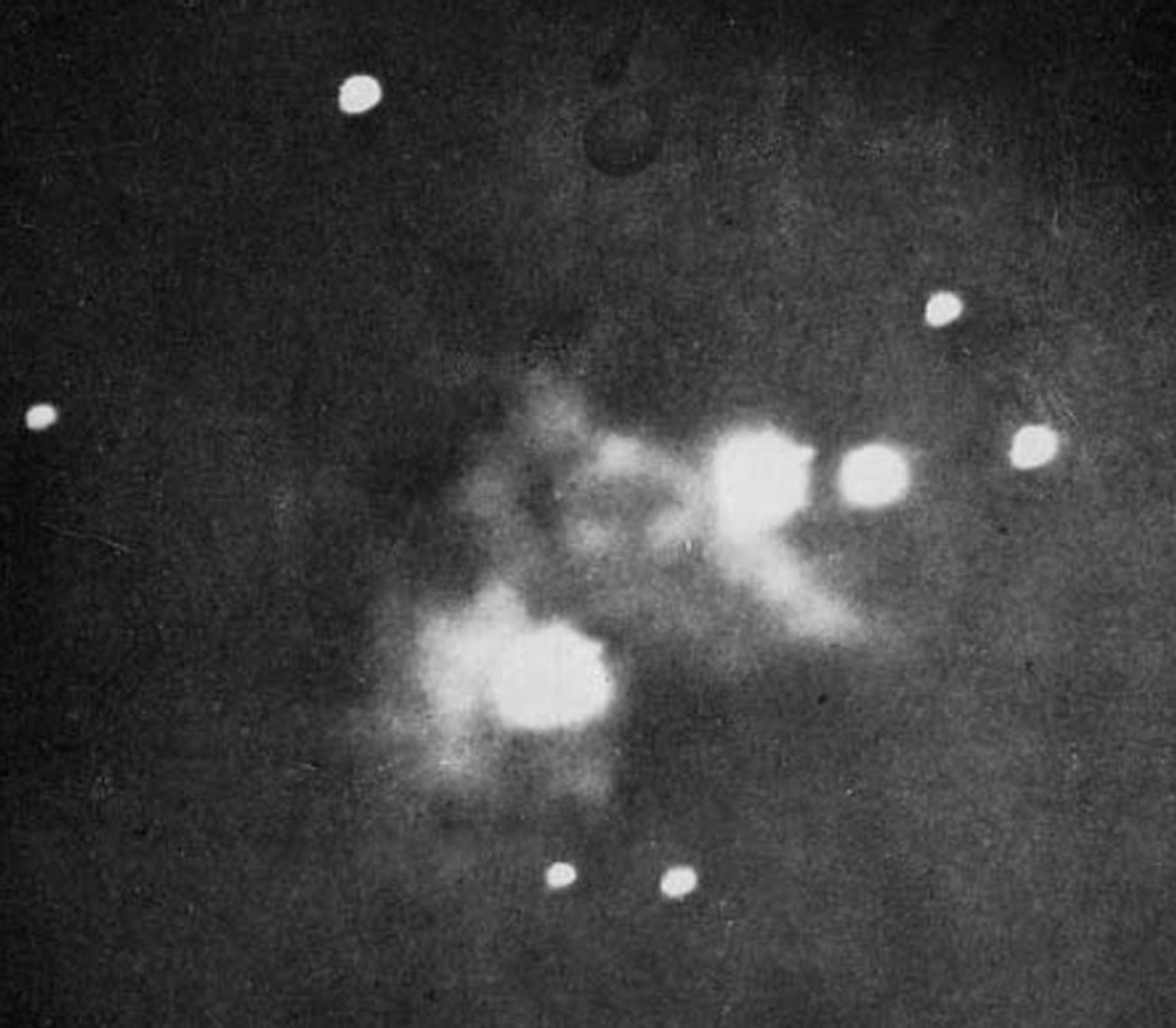 A black and white picture showing a fuzzy image of the Orion Nebula.