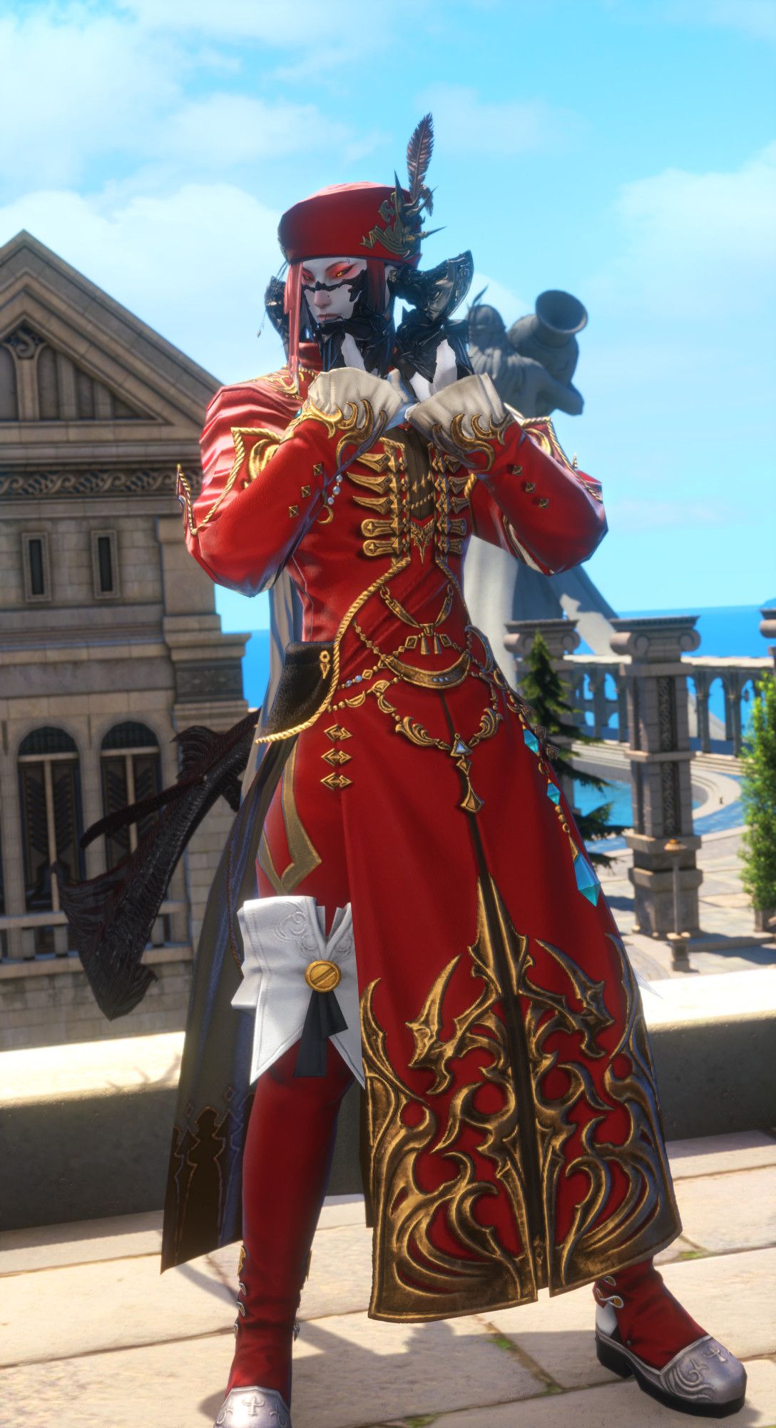 Male Au Ra striking a pose and grabbing his collars with both hands. He is wearing a long, ornate red-and-gold coat, red-and-gold tights and red-and-white thightboots. He is also wearing a red chapeau with a salmon red cloth covering half of his face.