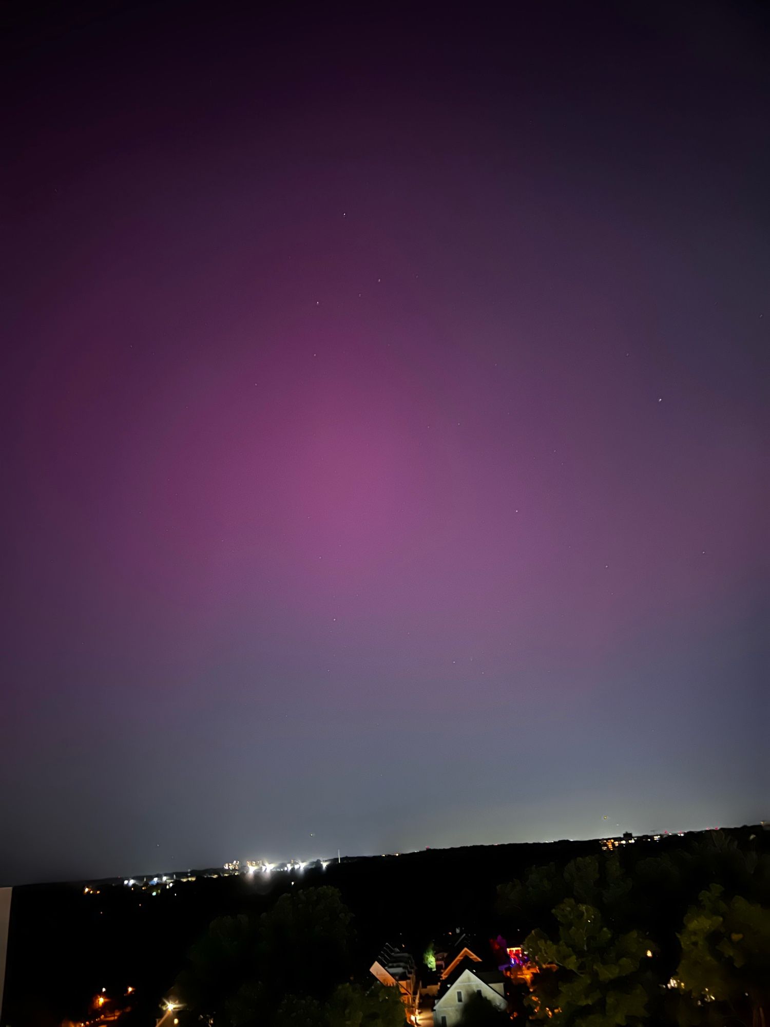 Sky with pink haze of aurora borealis, Silver Spring, MD. 12th-floor balcony.