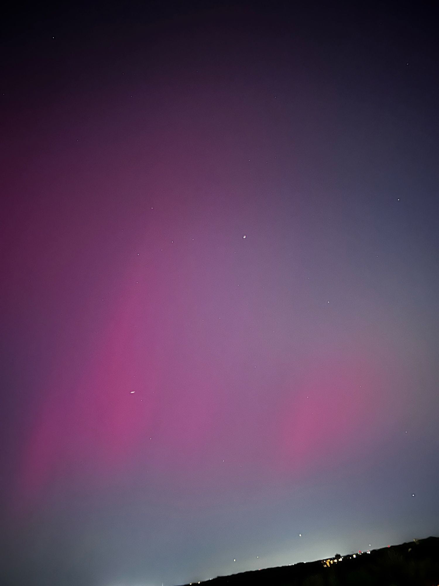 Sky with pink haze of aurora borealis, Silver Spring, MD. 12th-floor balcony.